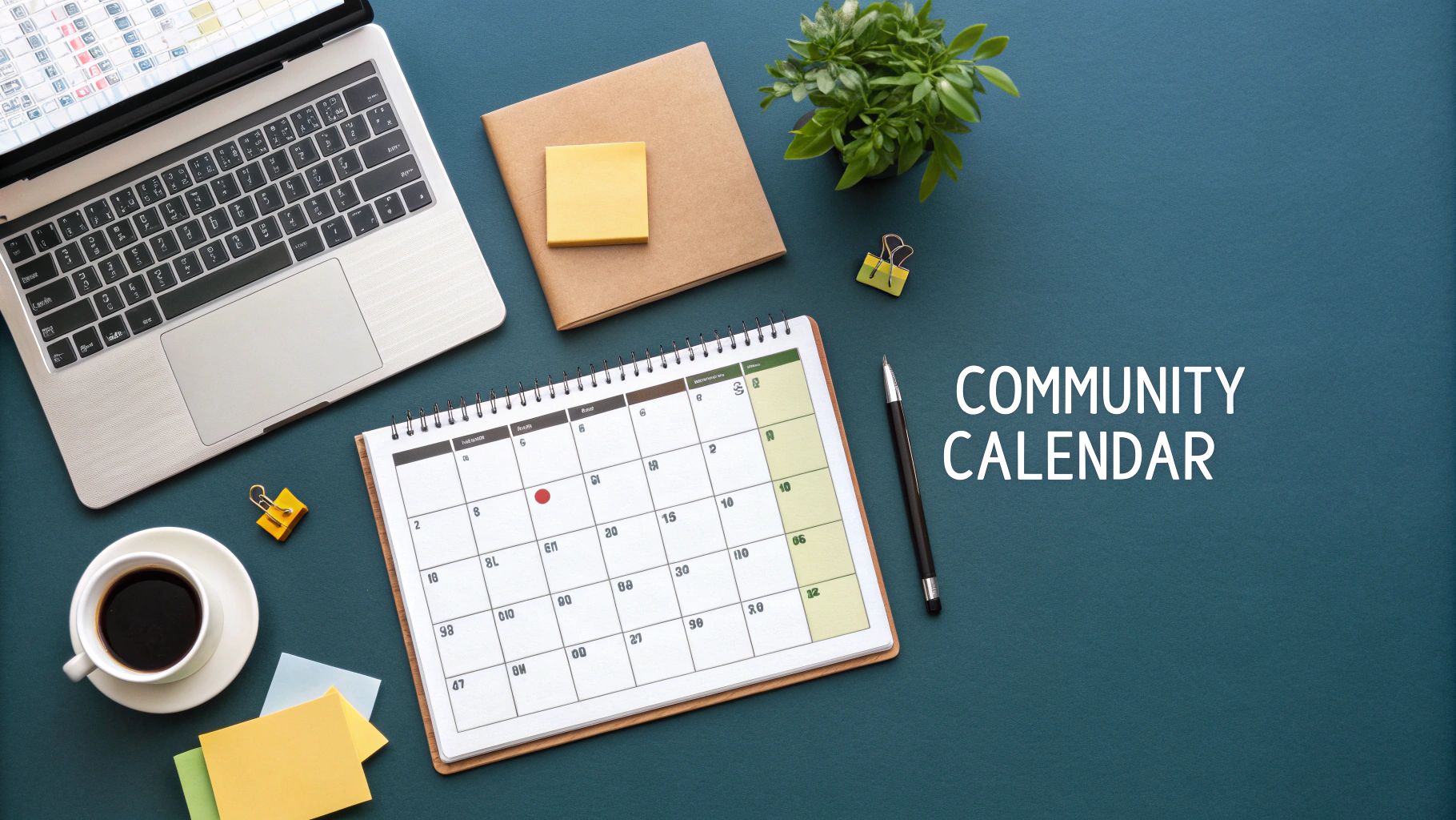 Flat lay of a desk with a laptop, coffee, sticky notes, and a calendar titled 'Community Calendar'.