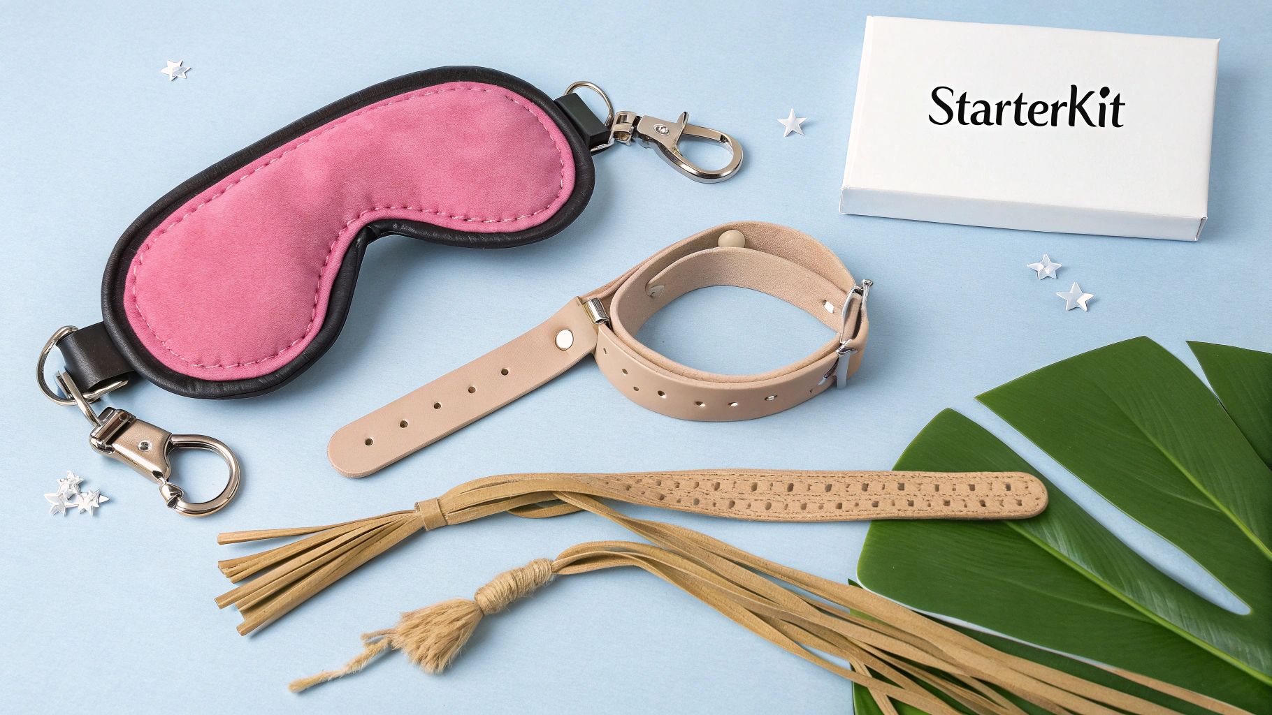 Een selectie van BDSM-startersitems, zoals een blinddoek en zachte boeien.