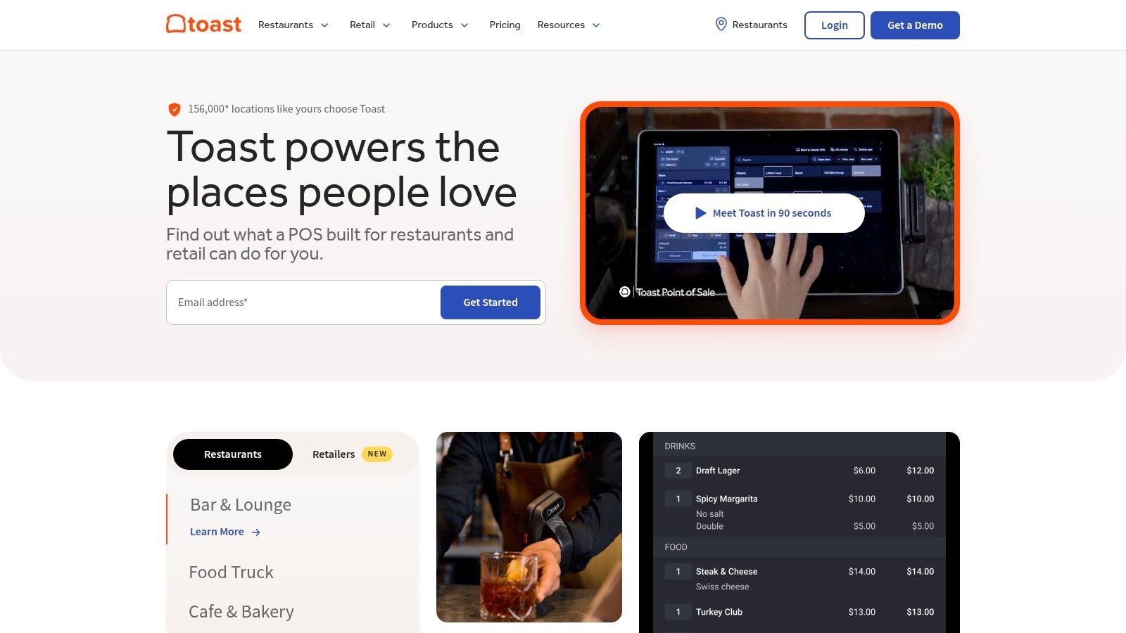 A restaurant worker using a Toast point of sale system on a counter.