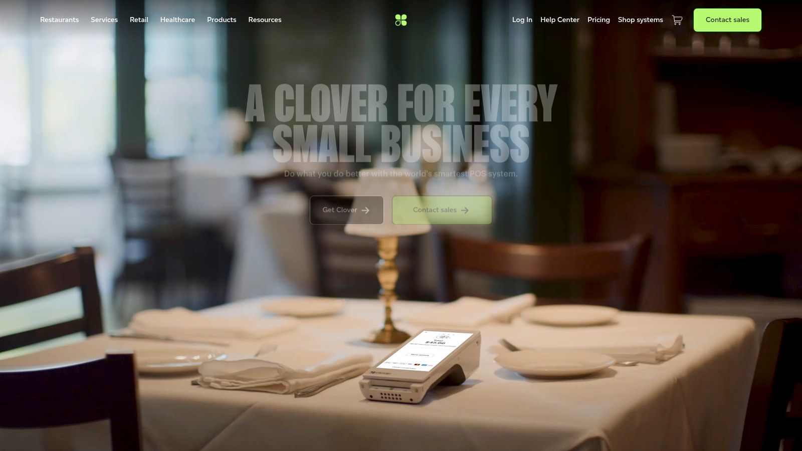 A restaurant employee using a handheld Clover Flex device to take an order at a table.