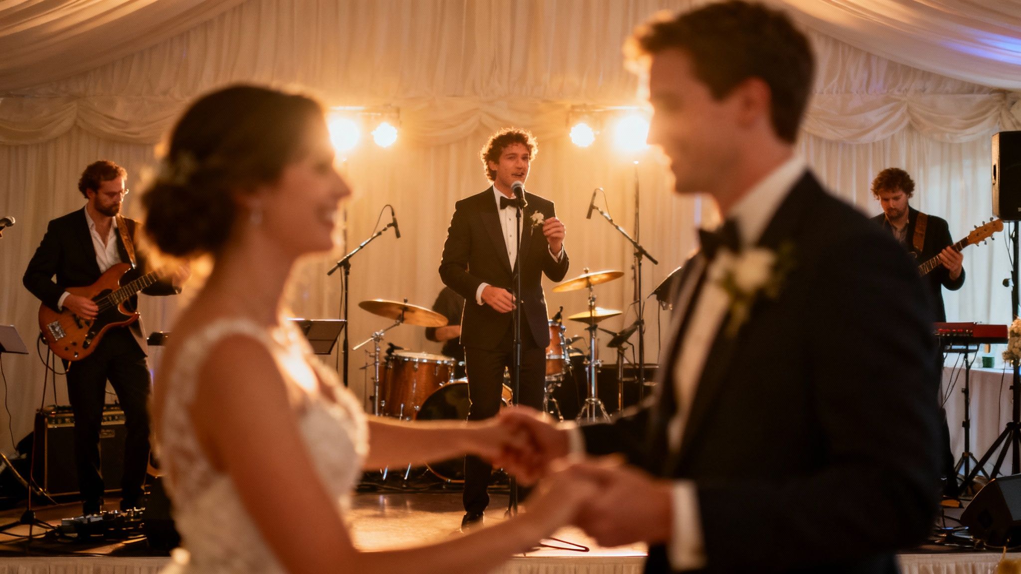 Live wedding band performing for bride and groom during elegant reception celebration