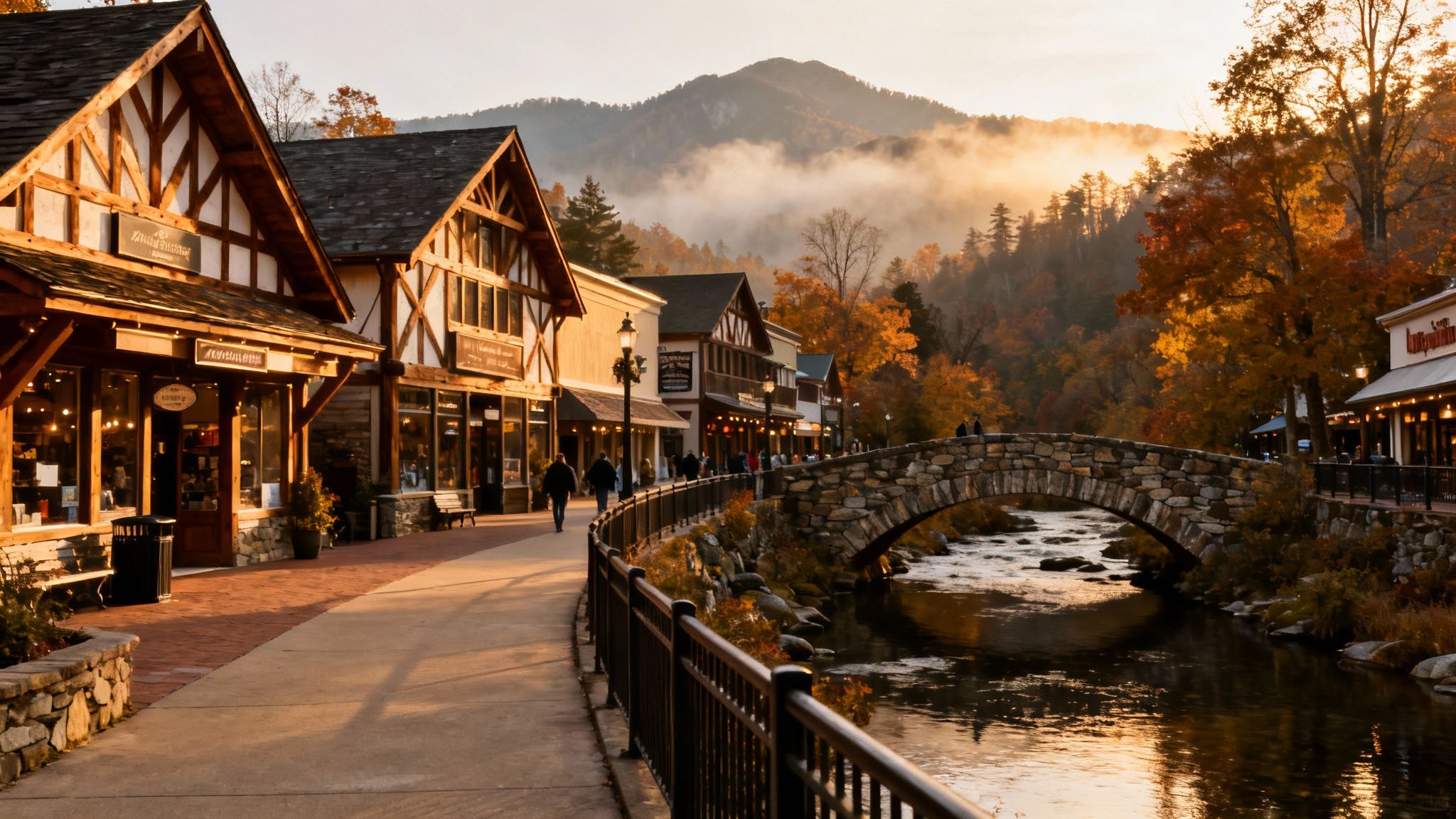 A picturesque autumn town scene with quaint shops, a stone bridge over a river, and misty mountains.