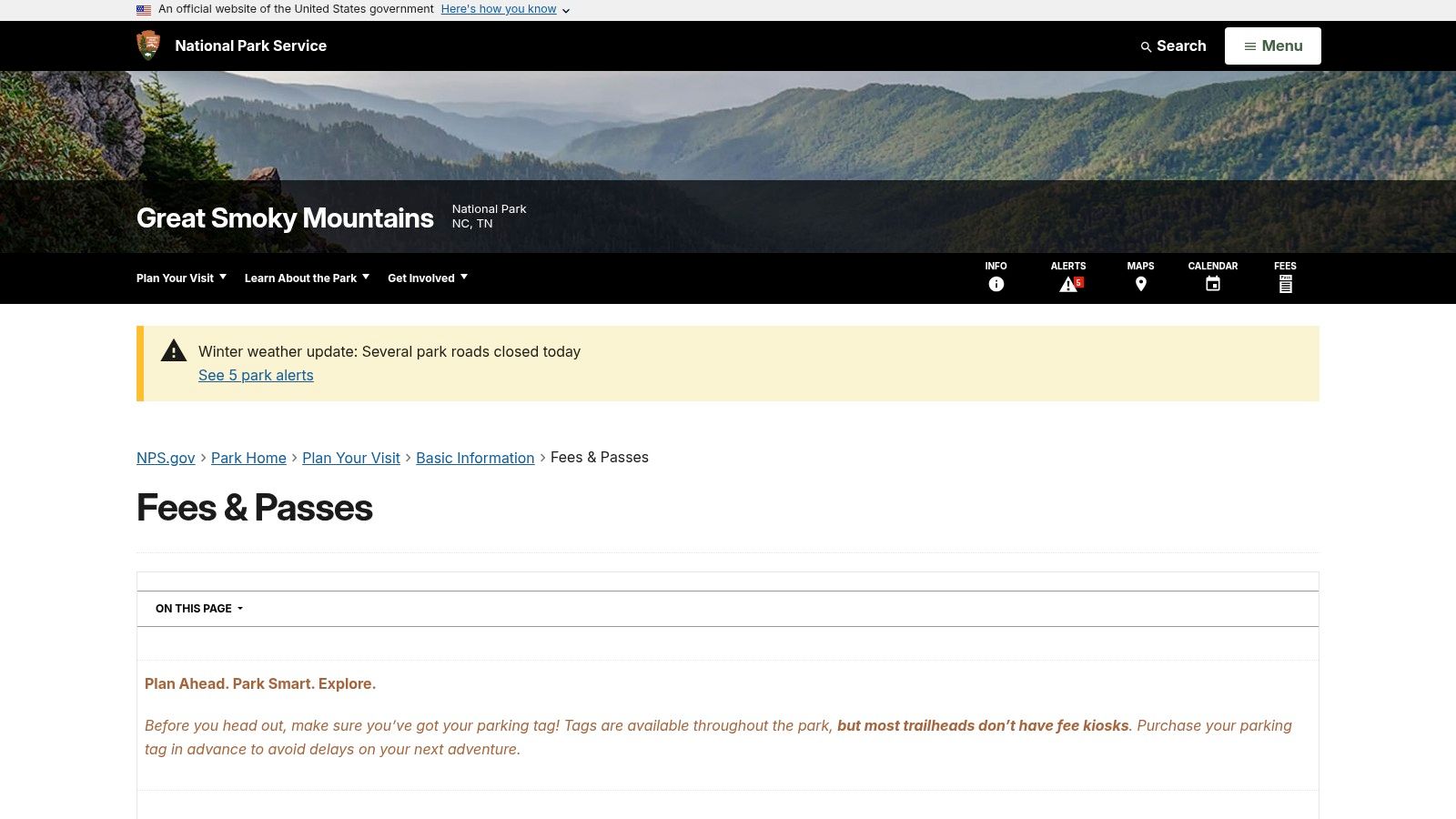 A sign at the entrance to the Great Smoky Mountains National Park indicating the parking tag requirement.