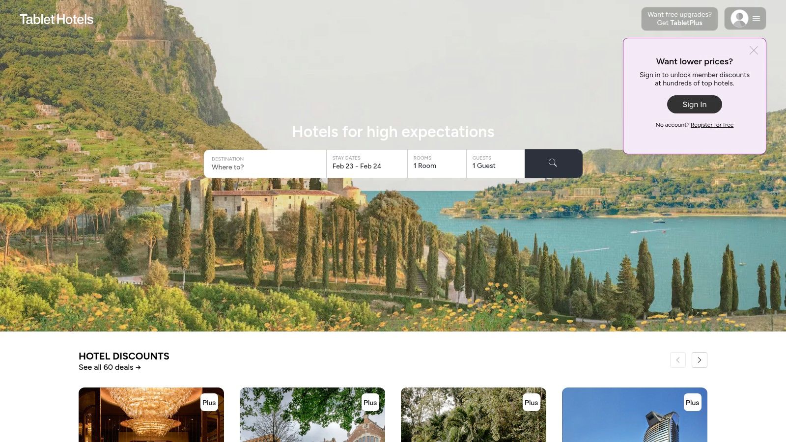 A dog sitting on a bed in a stylish, well-designed boutique hotel room, booked through Tablet Hotels.