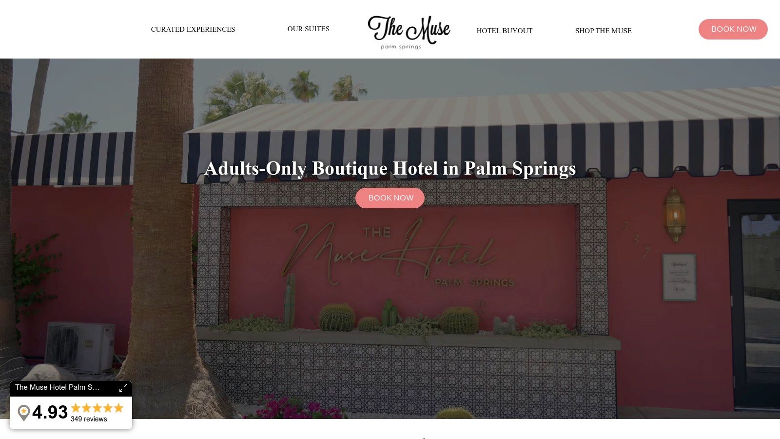 A stylish, pink-walled suite at The Muse Hotel Palm Springs with modern art and mid-century furniture, perfect for a Palm Springs Thanksgiving getaway.