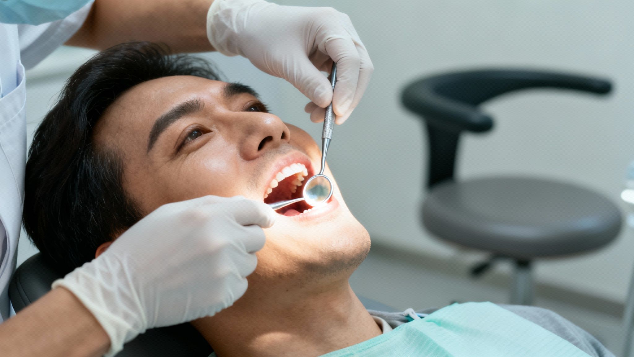 Dentist examining a patient's teeth in a modern clinic