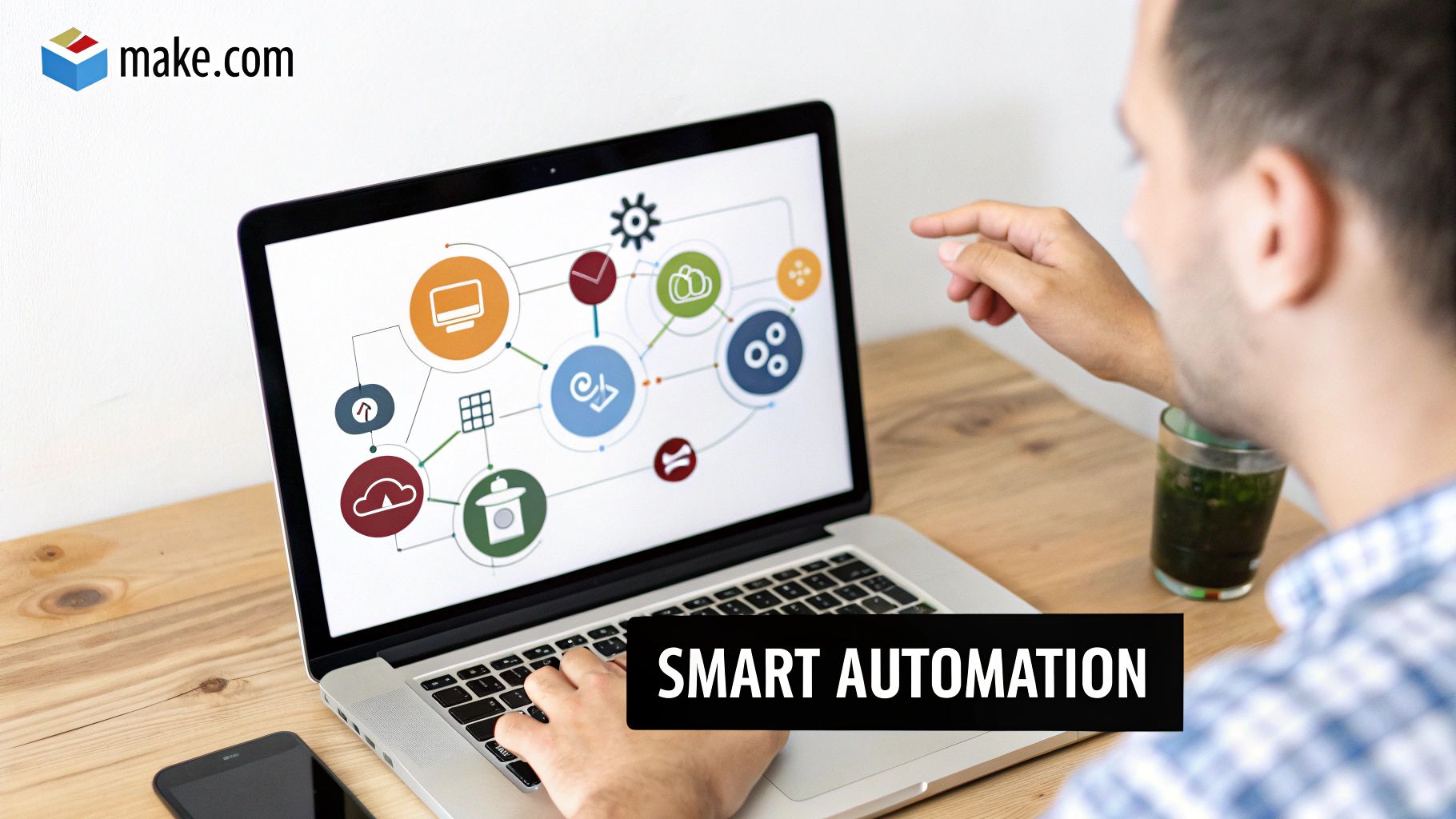 A man using a laptop displaying a 'Smart Automation' diagram with make.com logo, next to a smartphone.