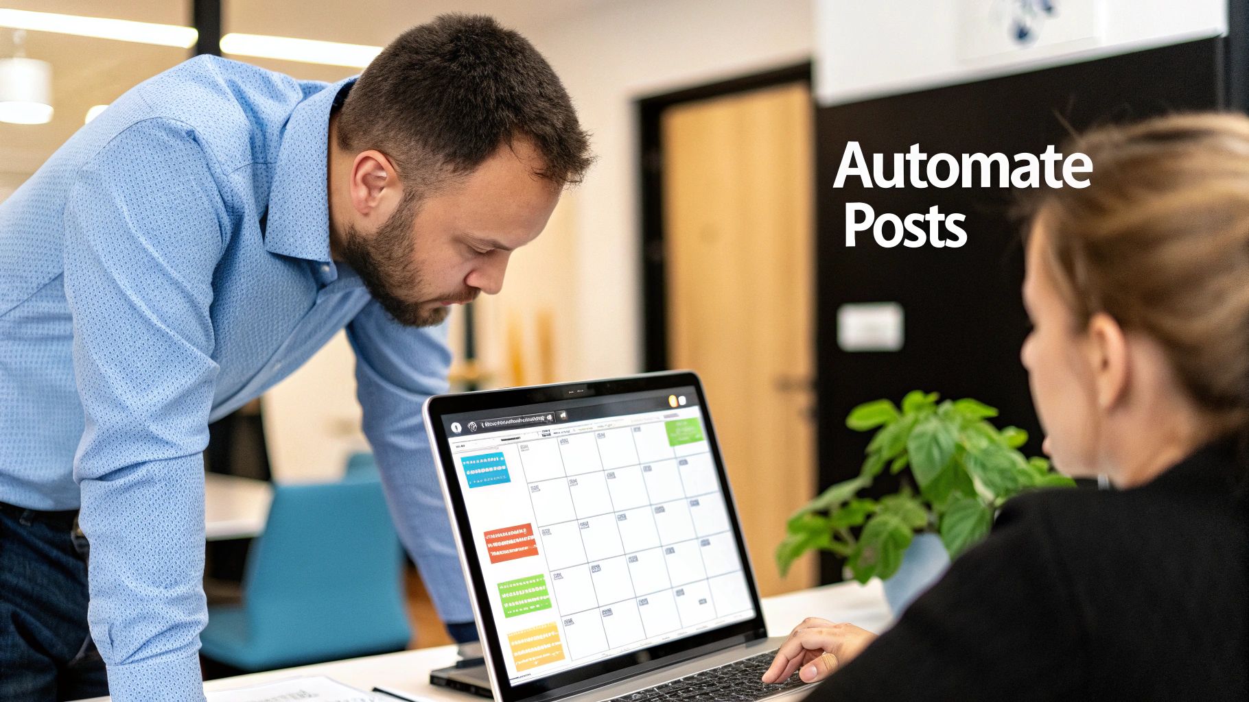 Two professionals collaborate on a laptop, using a scheduling app to automate posts.