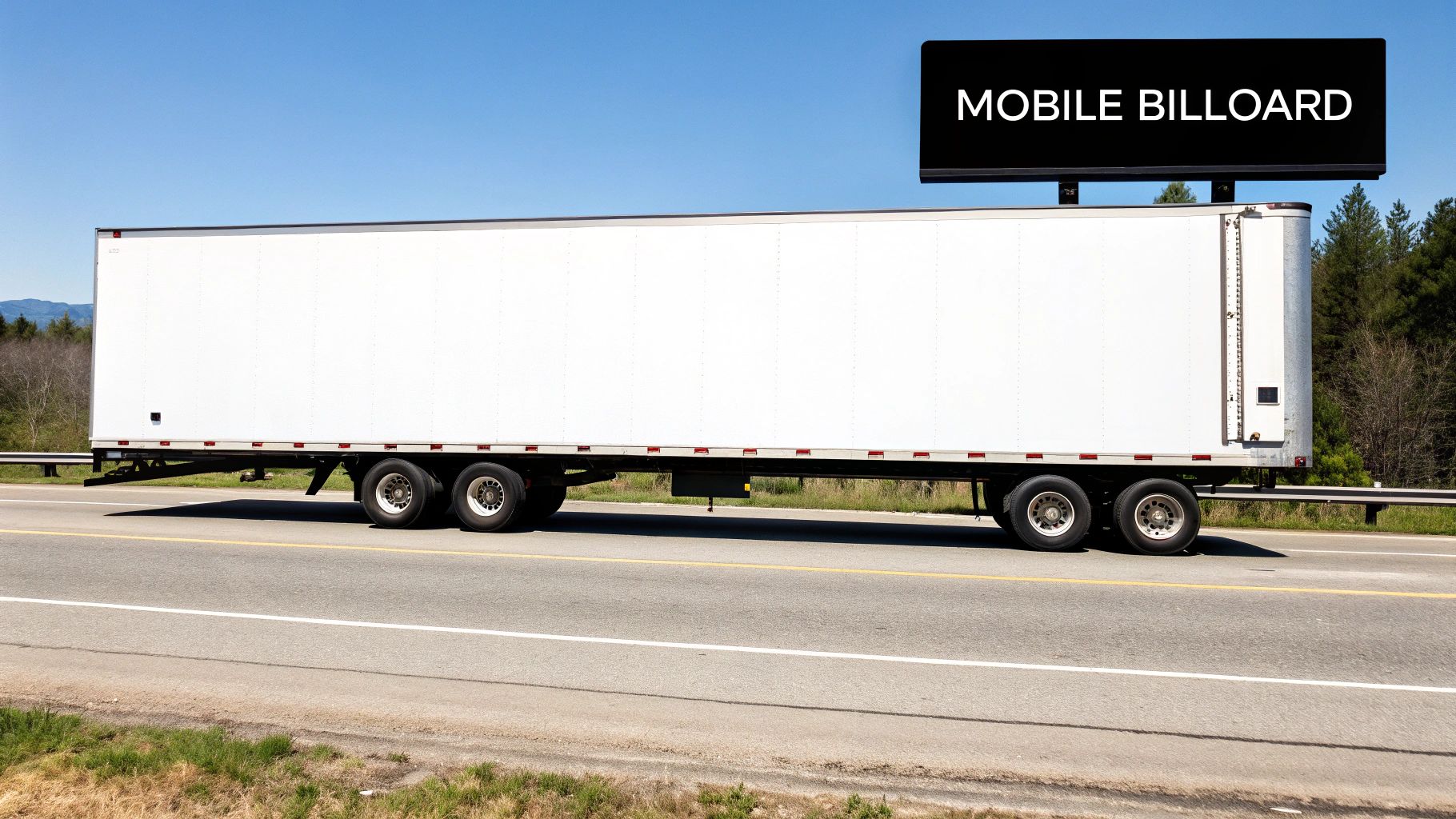 A close-up view of durable signage material on the side of a white commercial trailer.
