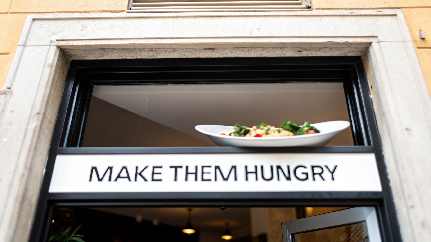 A bright, illuminated restaurant sign at night on a brick wall.