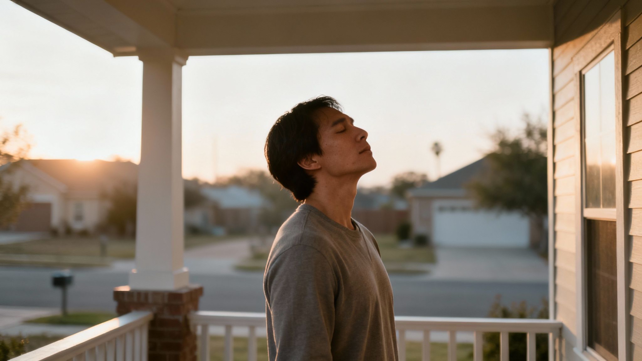 Man standing on porch, taking a deep breath at sunset, symbolizing courage and reflection amidst family safety concerns in Texas.