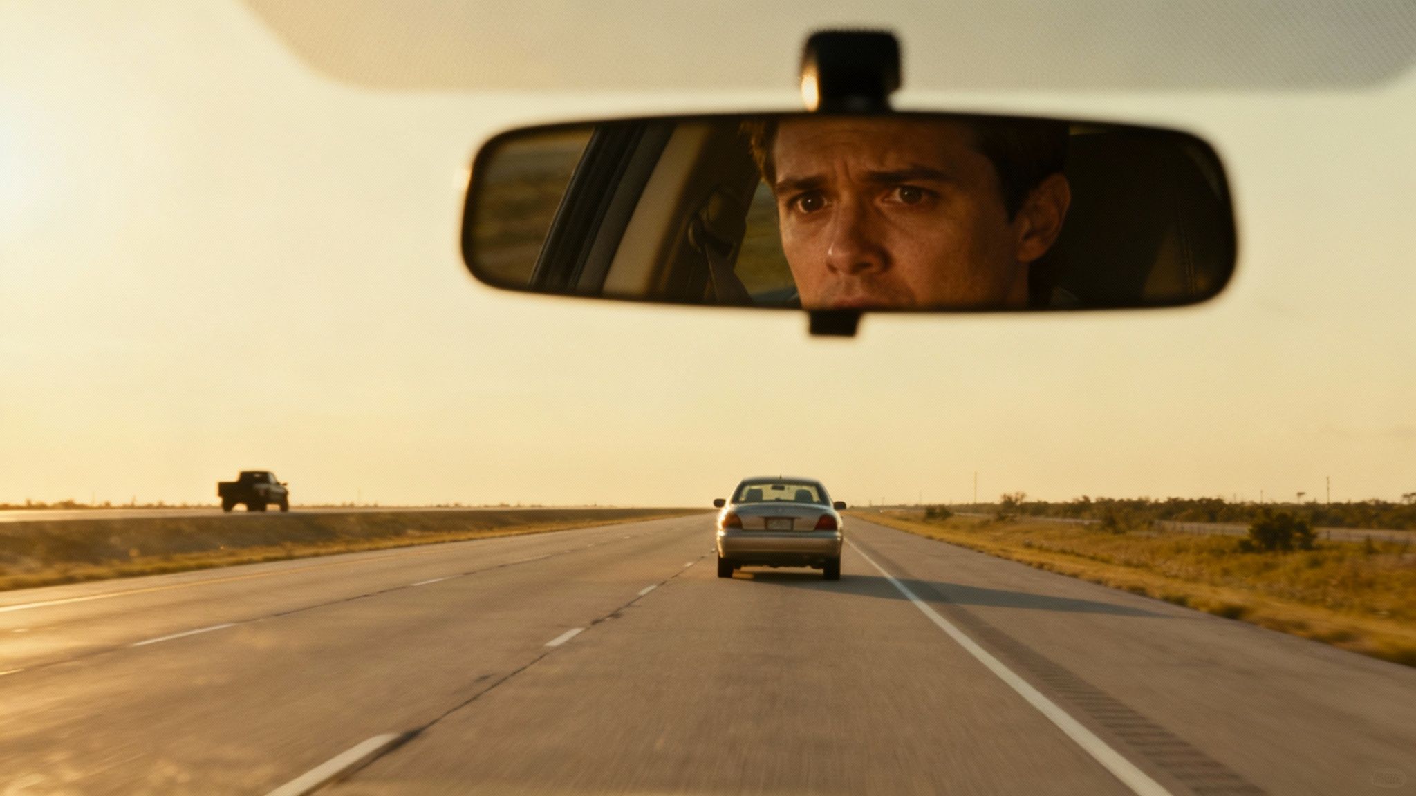 A car driving down a tree-lined Texas highway at sunset, symbolizing the hidden risks on the road.