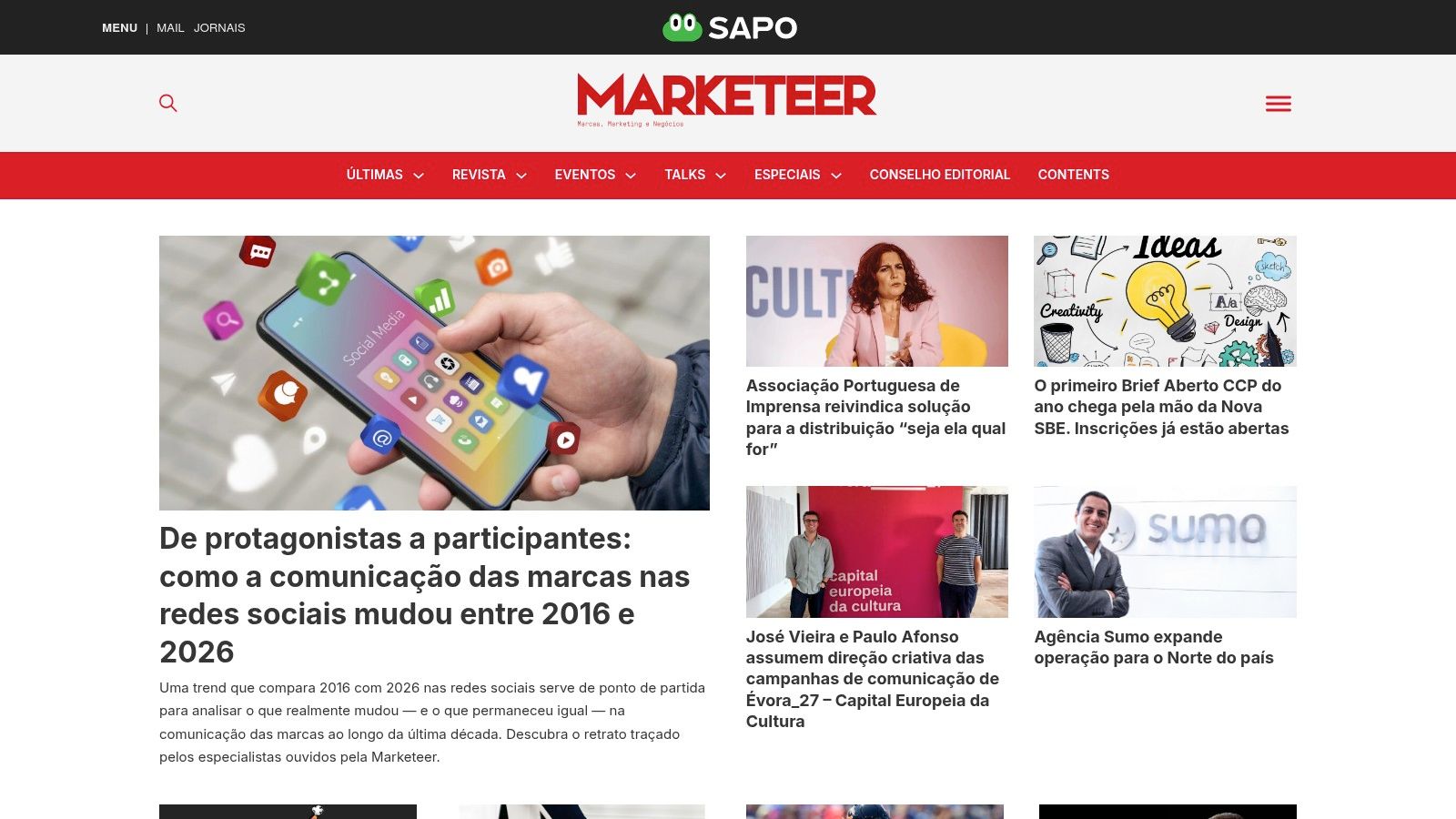 Público a assistir a uma apresentação na Conferência Marketeer, com o logótipo do evento visível no ecrã.