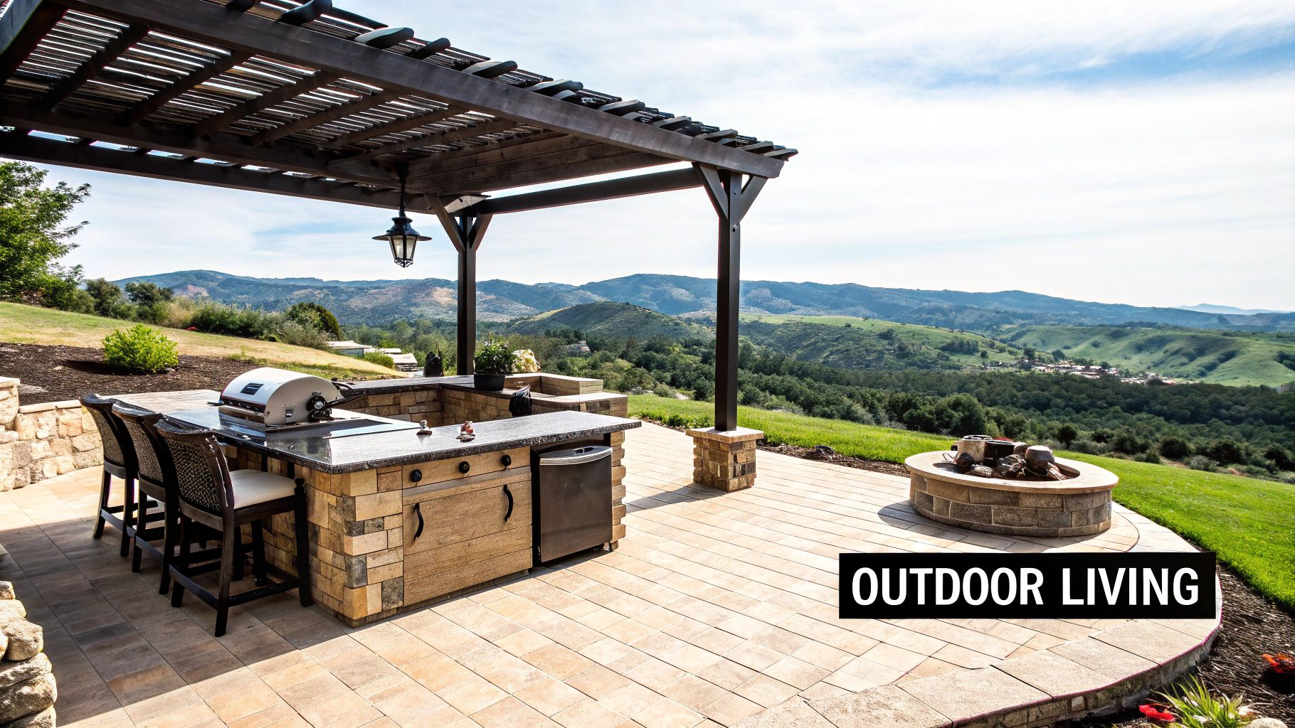 A custom stone patio with an outdoor kitchen in a beautifully landscaped backyard.