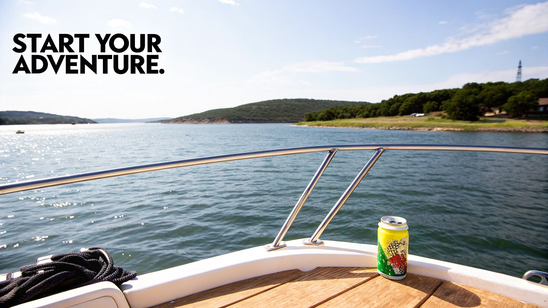 A view from the front of a boat on a sunny lake with hills, featuring a drink can and coiled rope.