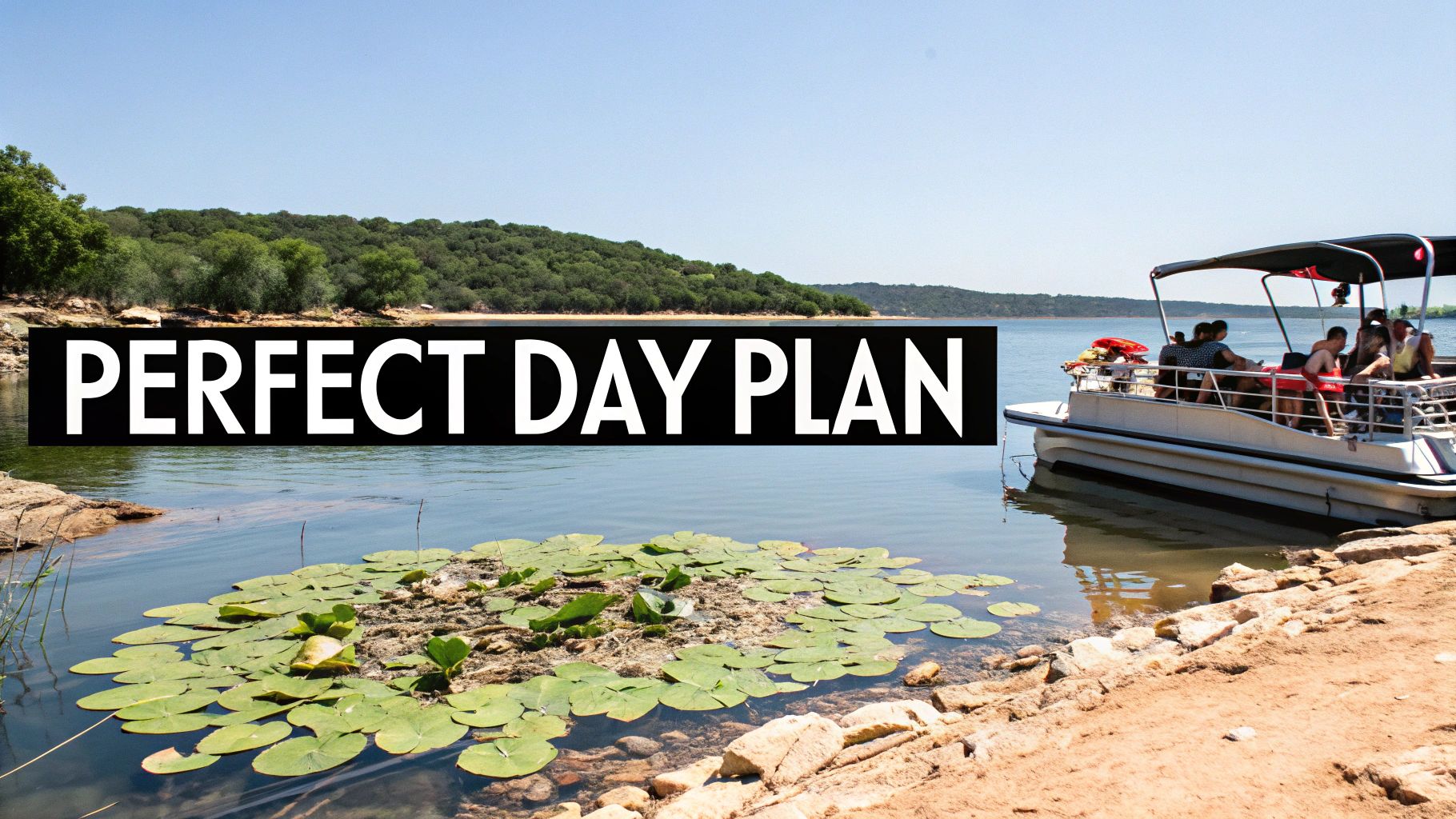 A pontoon boat with people on a sunny lake next to a sandy shore and lily pads.