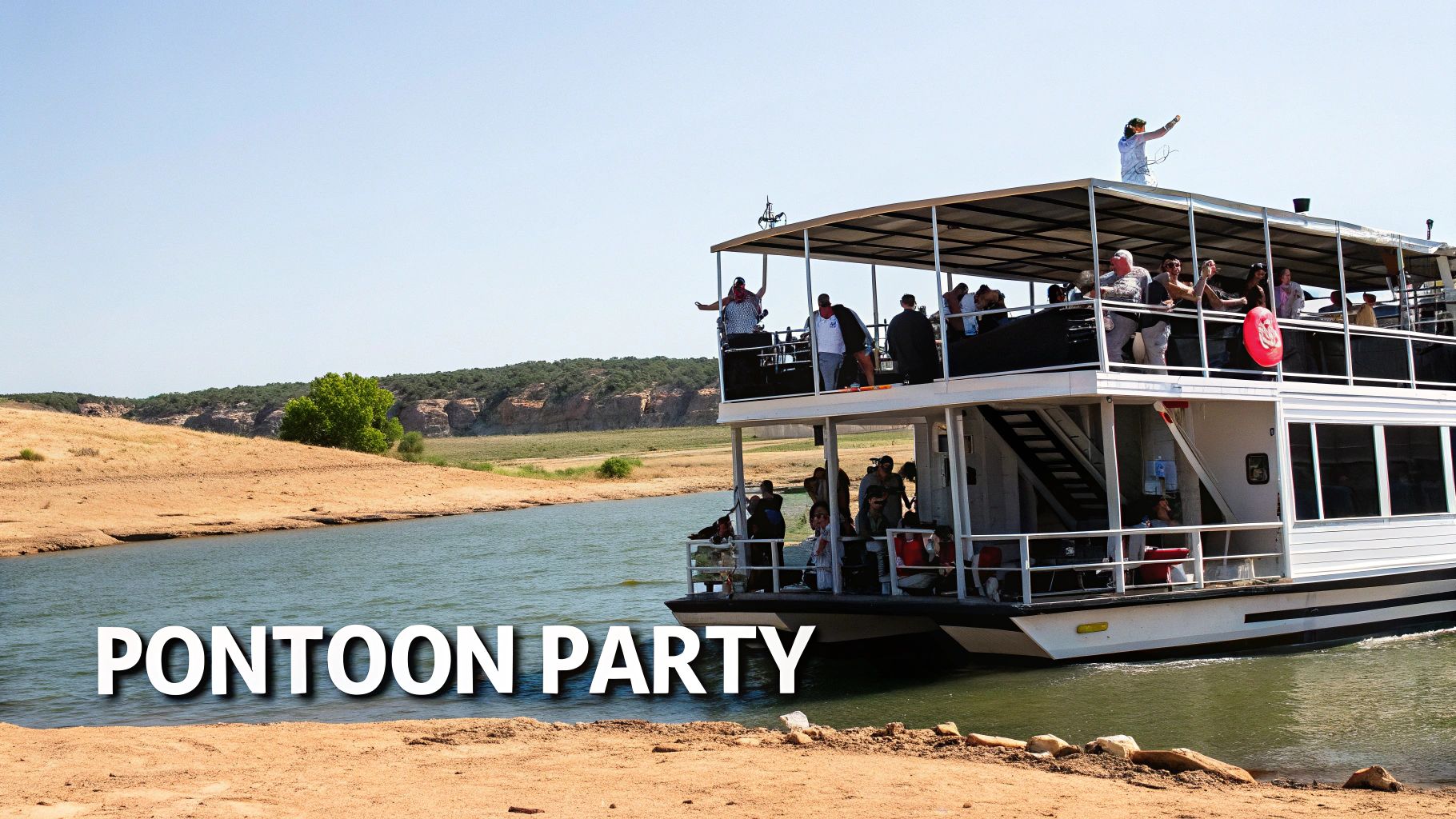 A large, two-story pontoon boat filled with people on a party cruise on a sunny day.