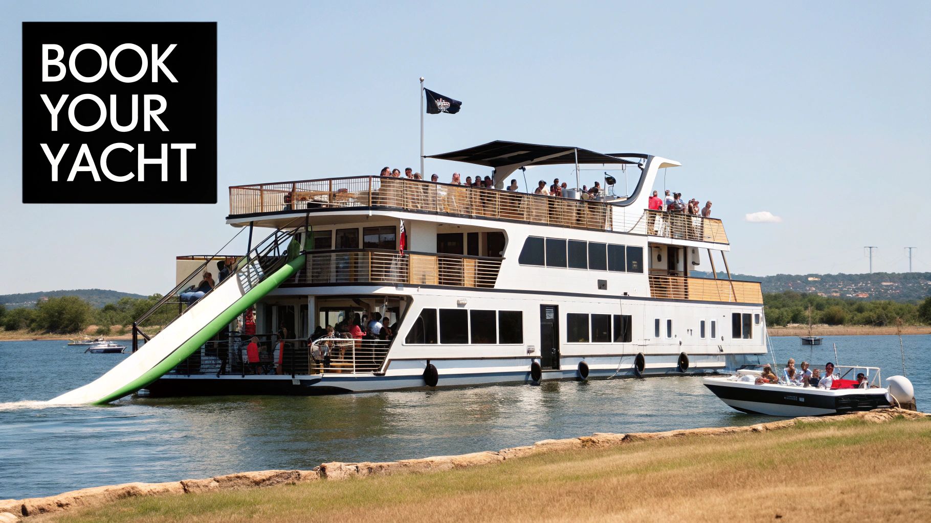 A large multi-deck party yacht with a green water slide in a serene lake, filled with people.