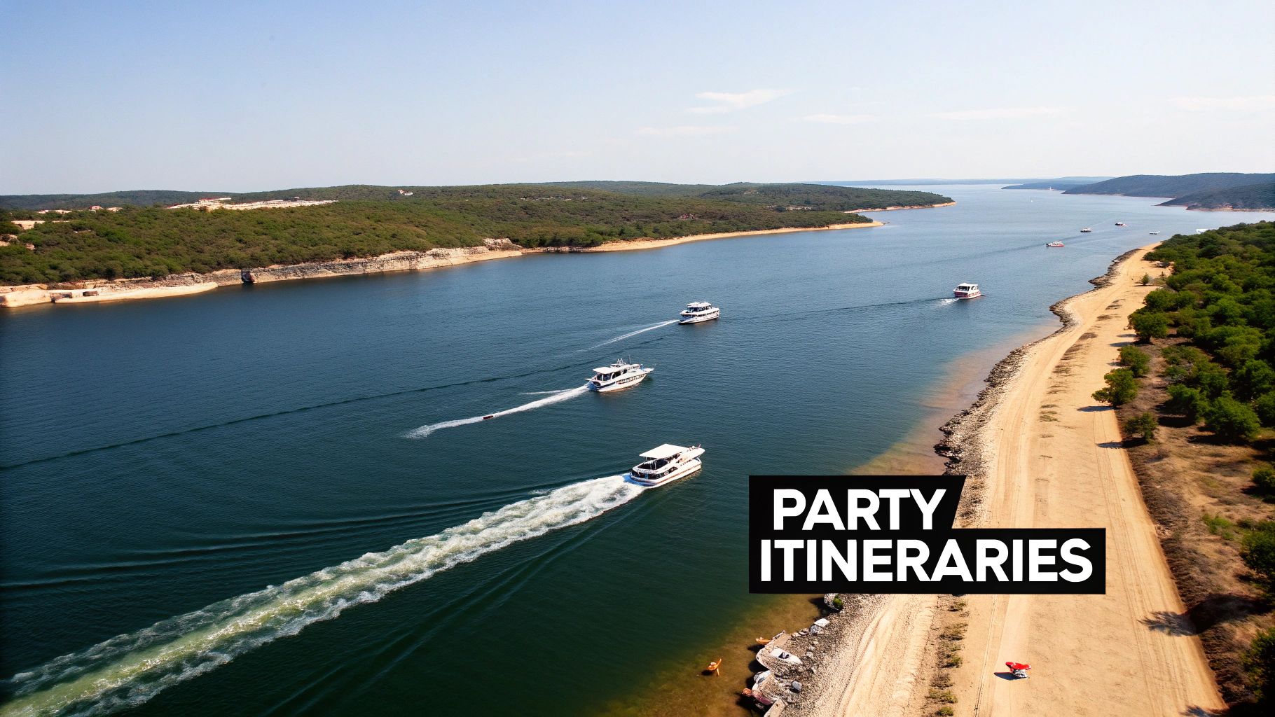 Several white boats cruise on a beautiful lake, leaving wakes, with green forested shores.