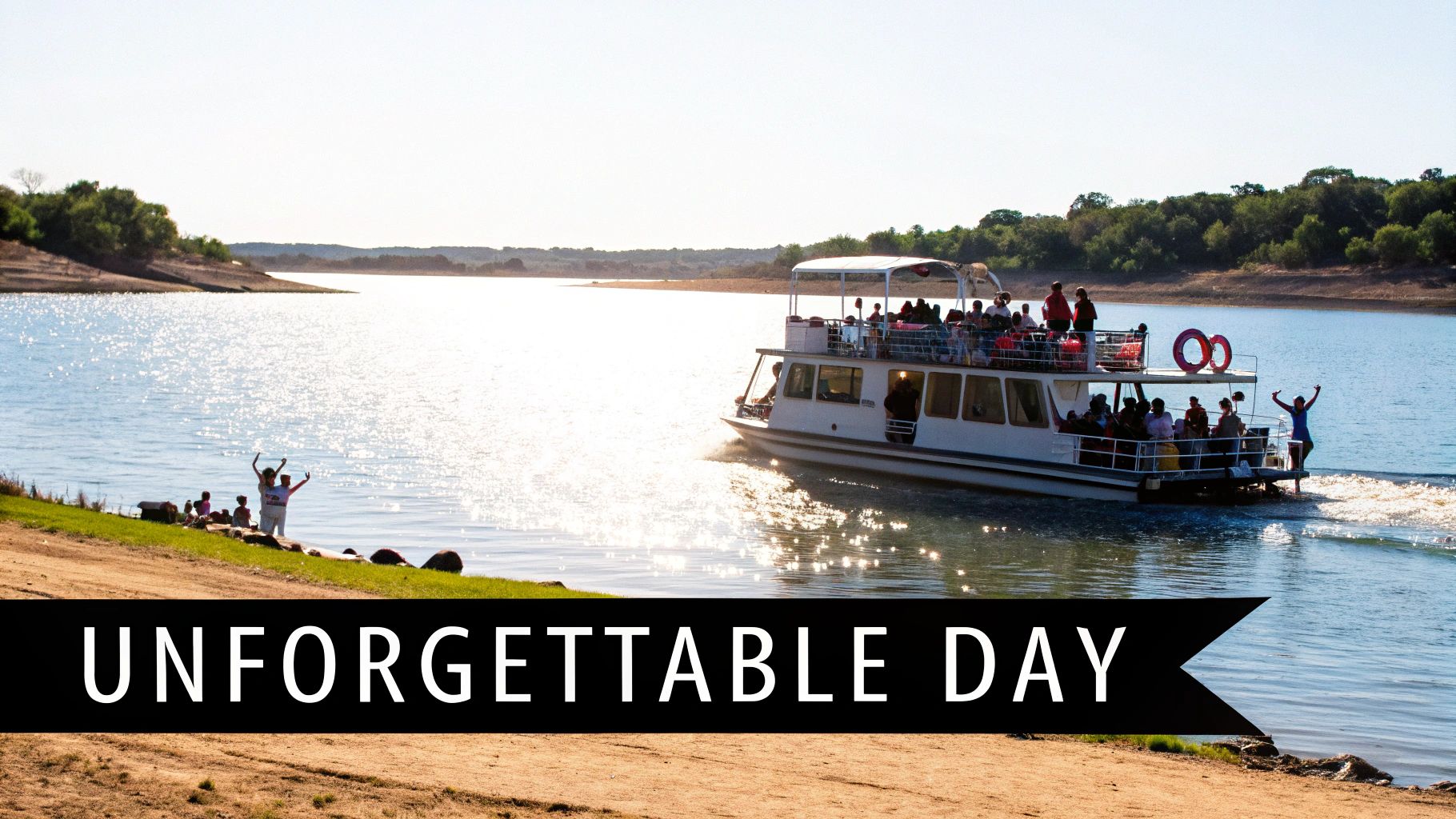 A lively party boat full of people cruises on a sparkling lake, with others waving from the shore.