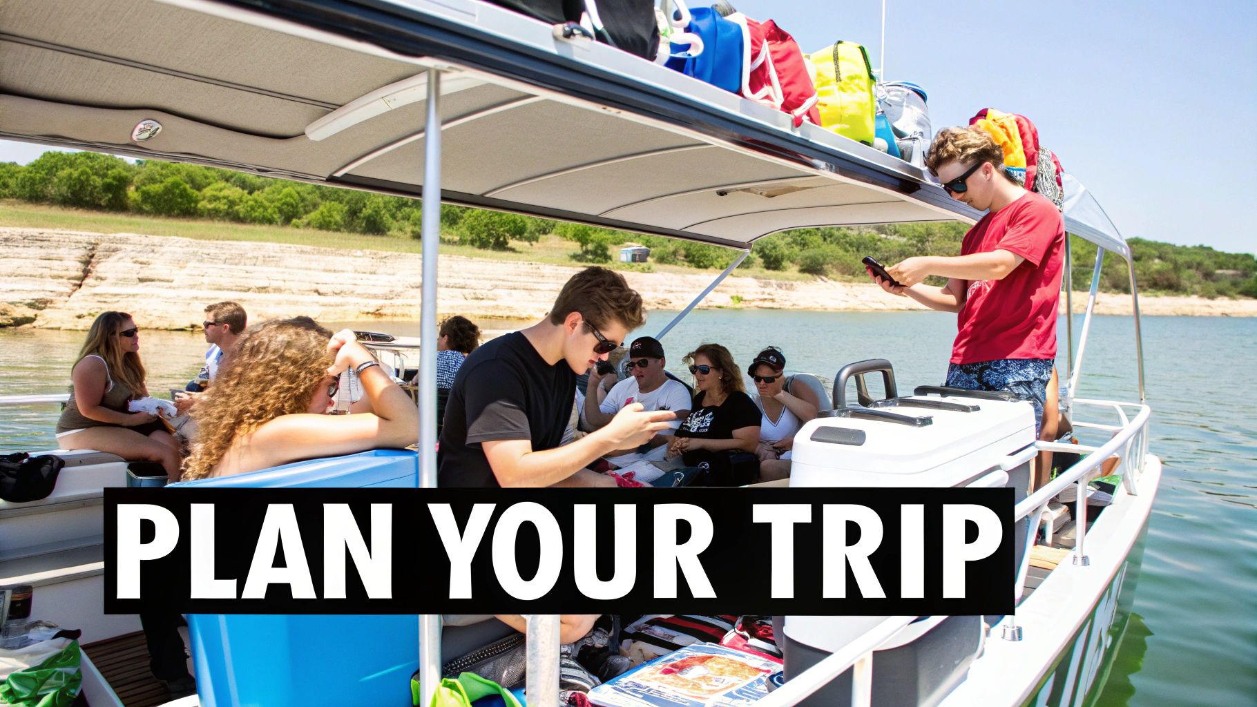 A group of friends relaxing and using phones on a double-decker boat on a sunny lake.