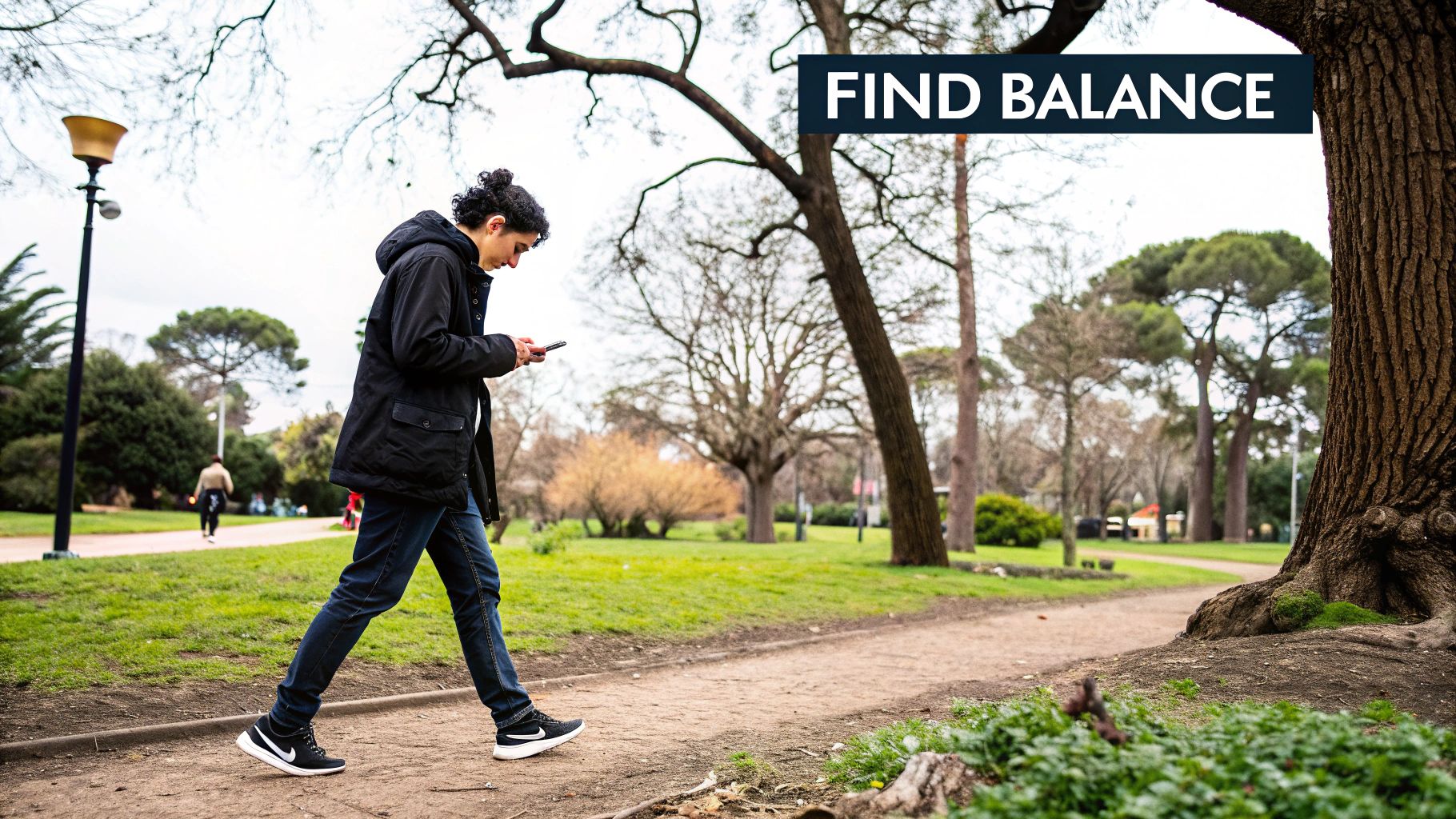 A person's hands holding a smartphone, with the screen displaying organised app folders and a calm background.