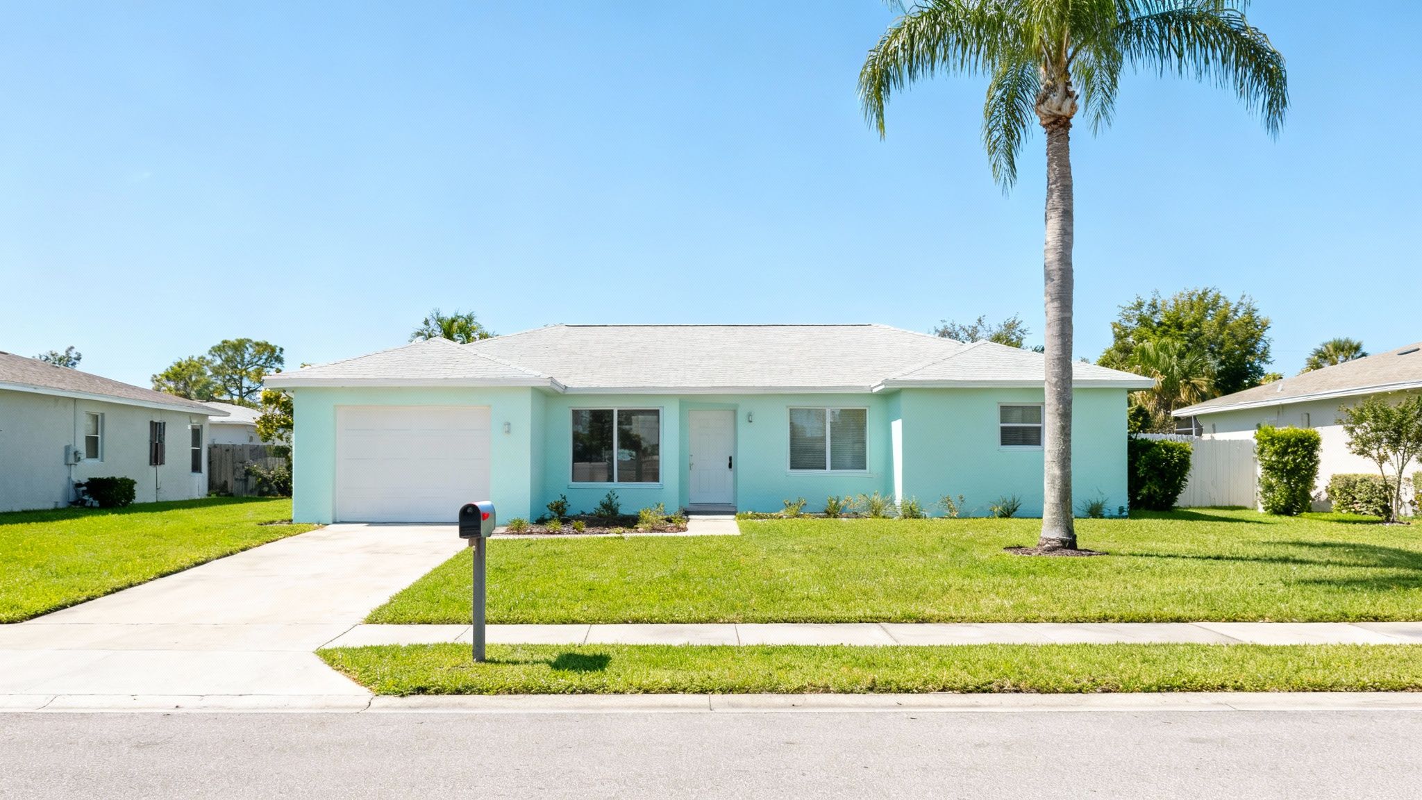 A sunny neighborhood street in a Florida community