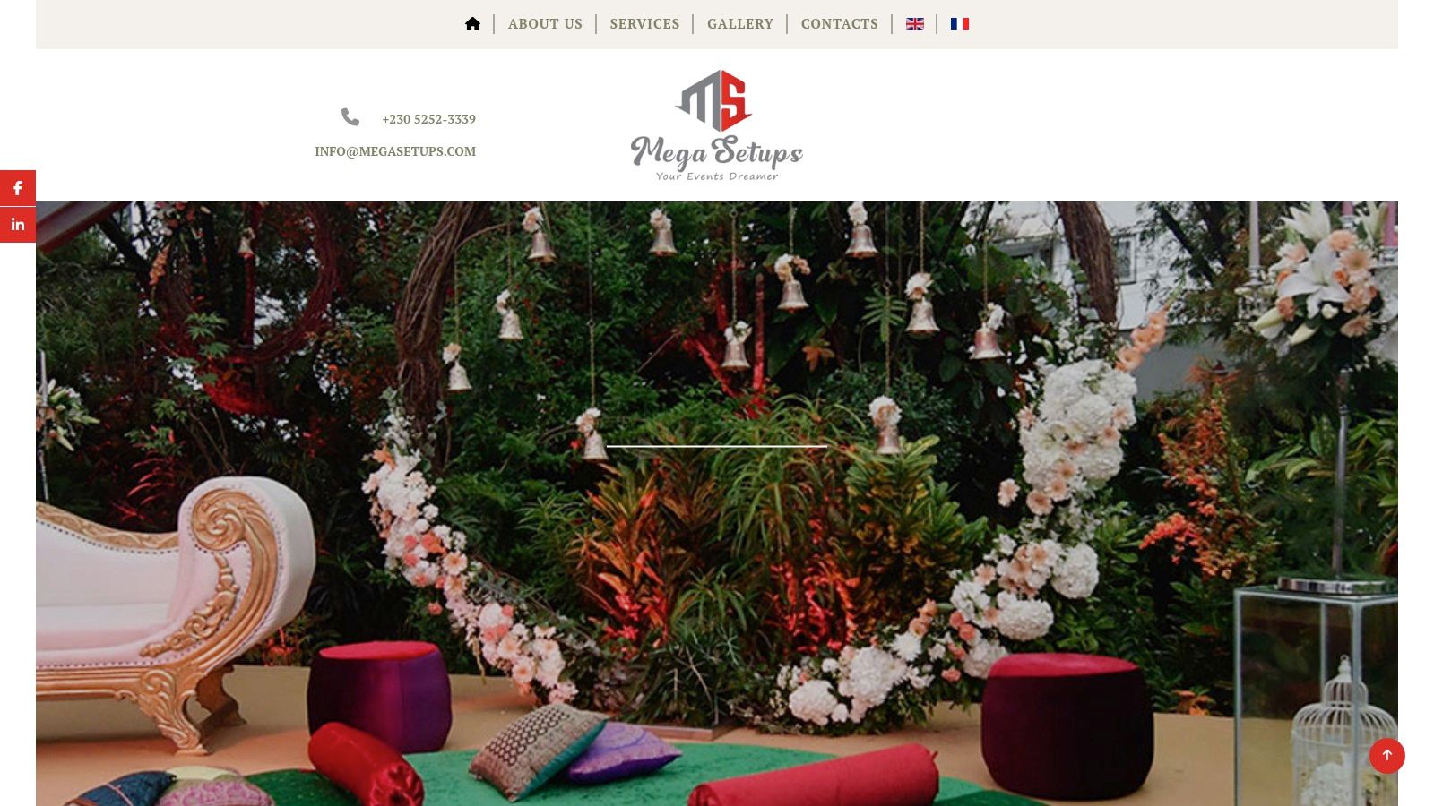 A large, elegantly decorated marquee tent set up for a wedding reception in Mauritius.