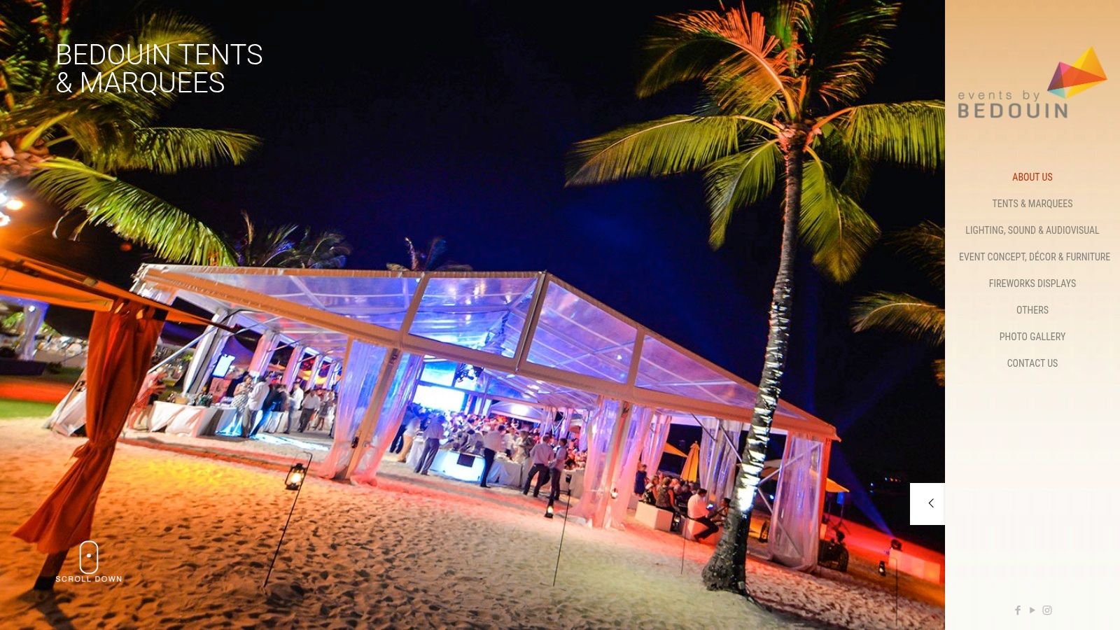 A stylish white stretch tent set up for a beach party in Mauritius, with elegant lighting and lounge furniture inside.