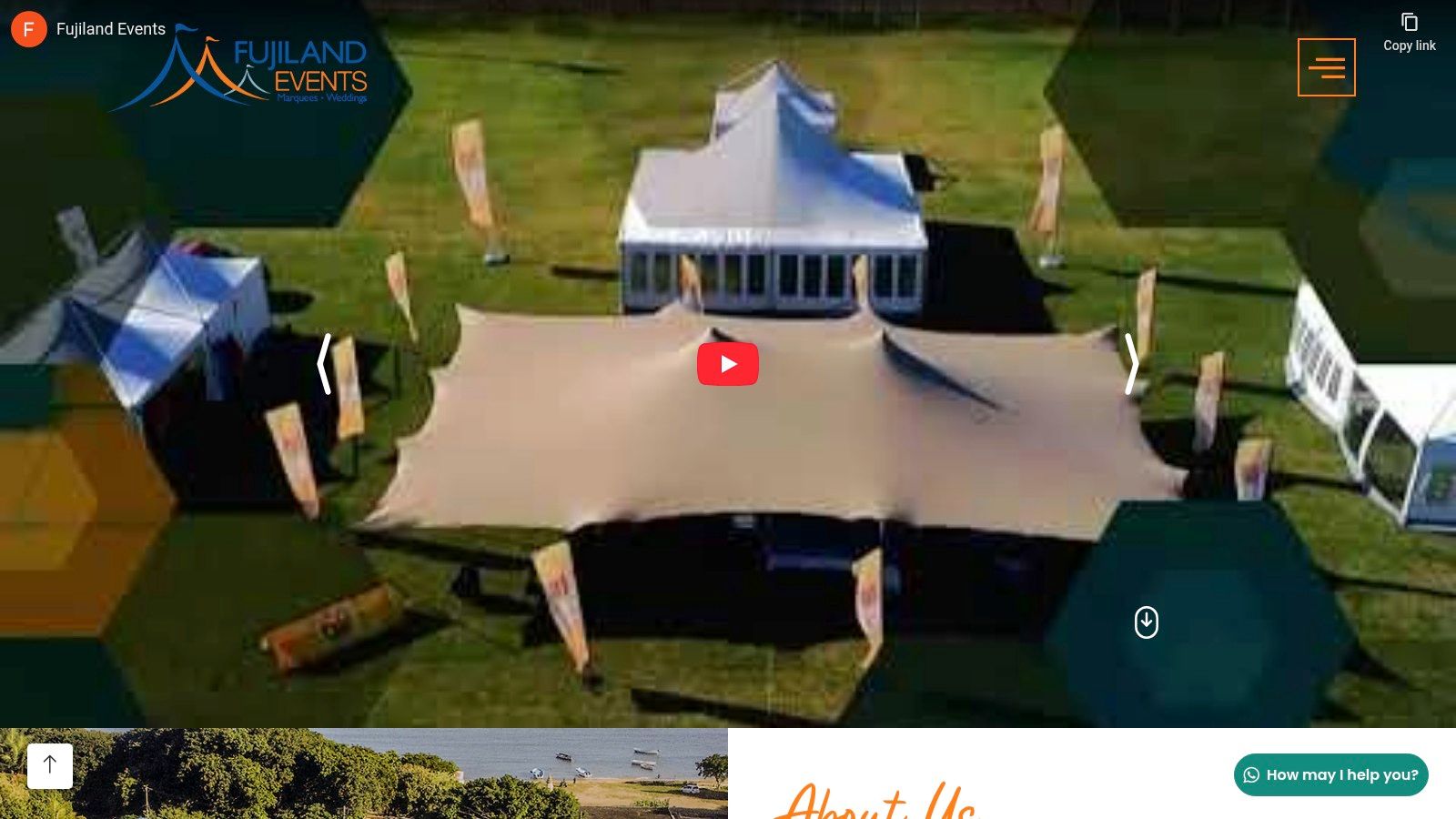 An elegant white marquee set up for a wedding reception in Mauritius, with beautiful lighting and table settings inside.