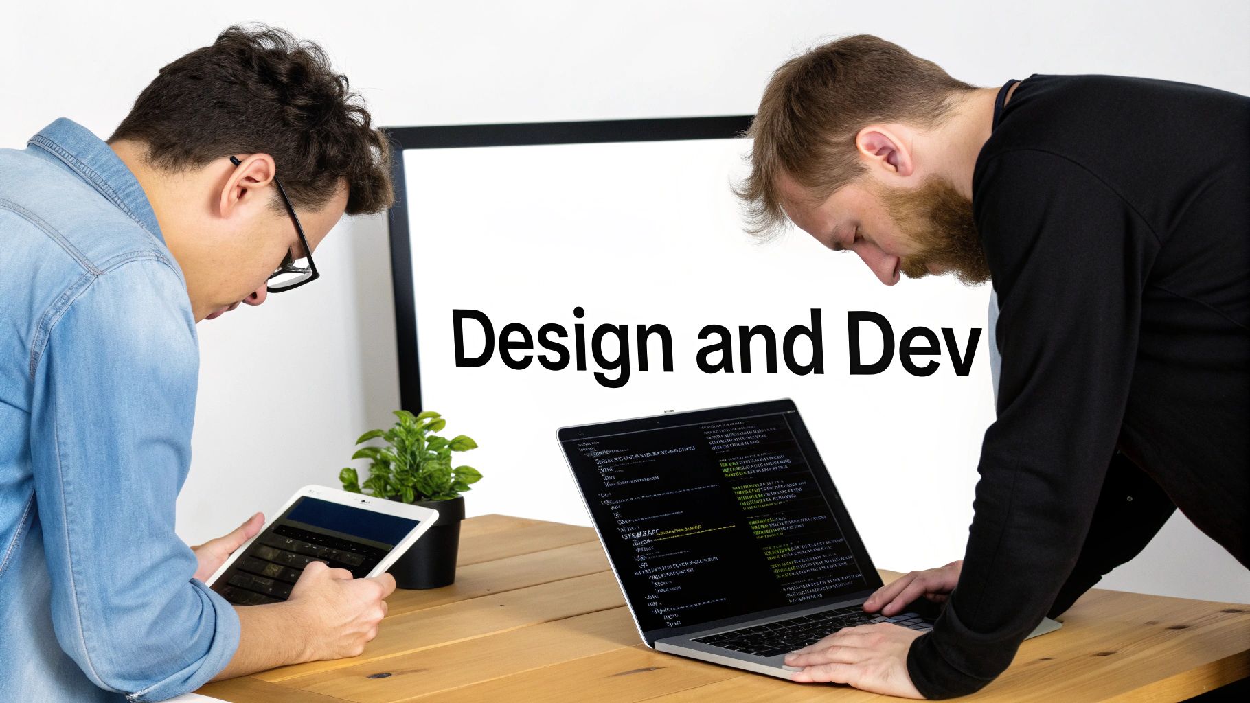 Two developers collaborating on a project, one using a tablet, the other coding on a laptop.