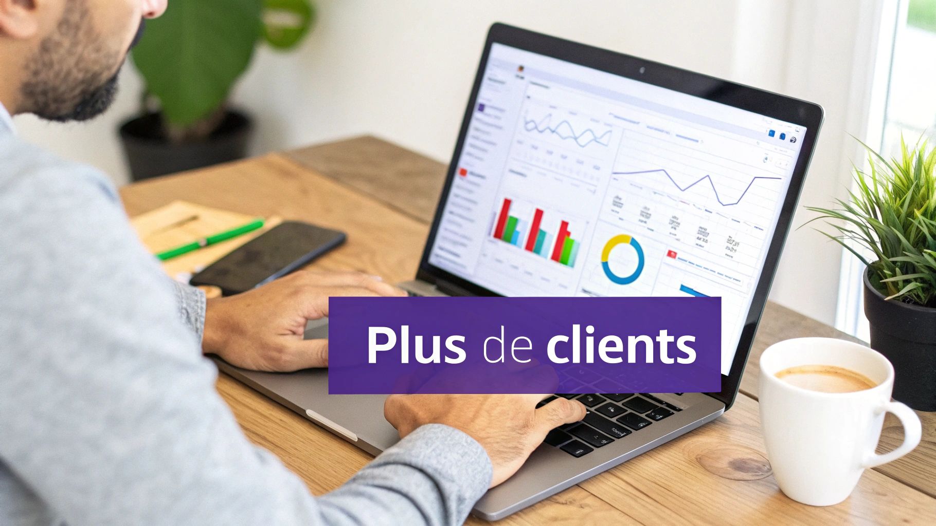 Un homme utilise un ordinateur portable affichant des graphiques de données, avec le texte 