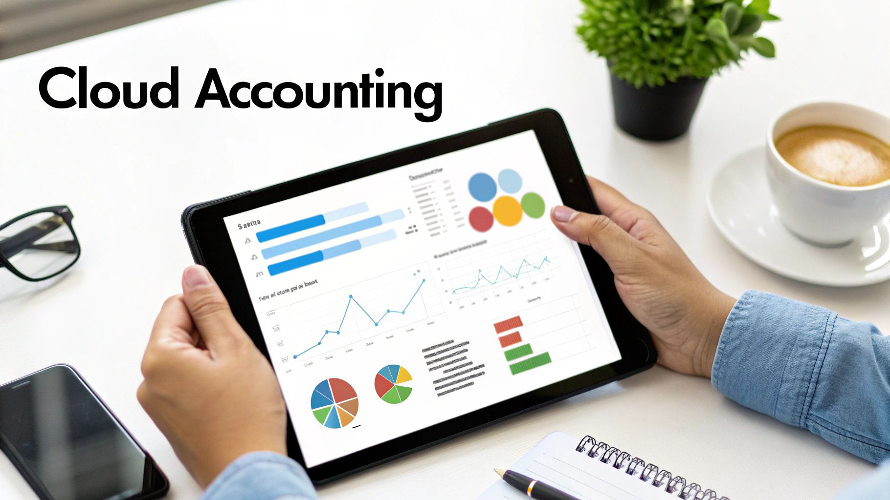 A person uses a tablet displaying financial charts and graphs, representing cloud accounting.
