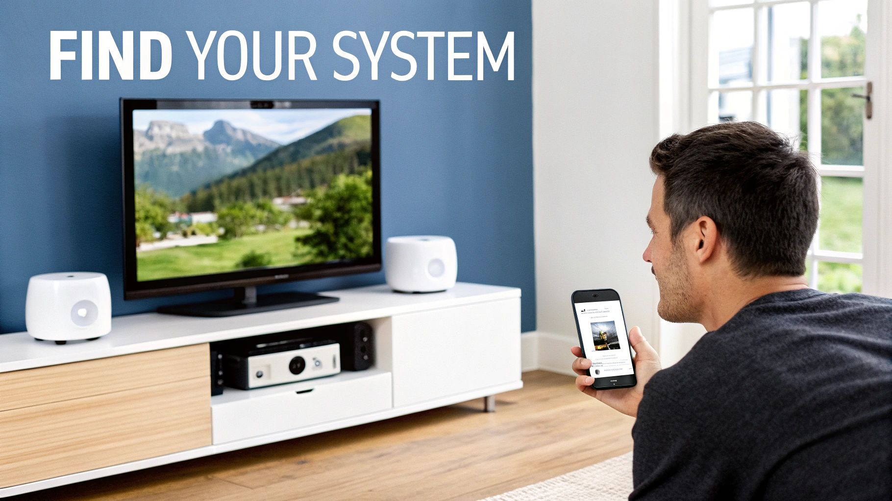 Man using smartphone to control a smart home entertainment system with TV and speakers.