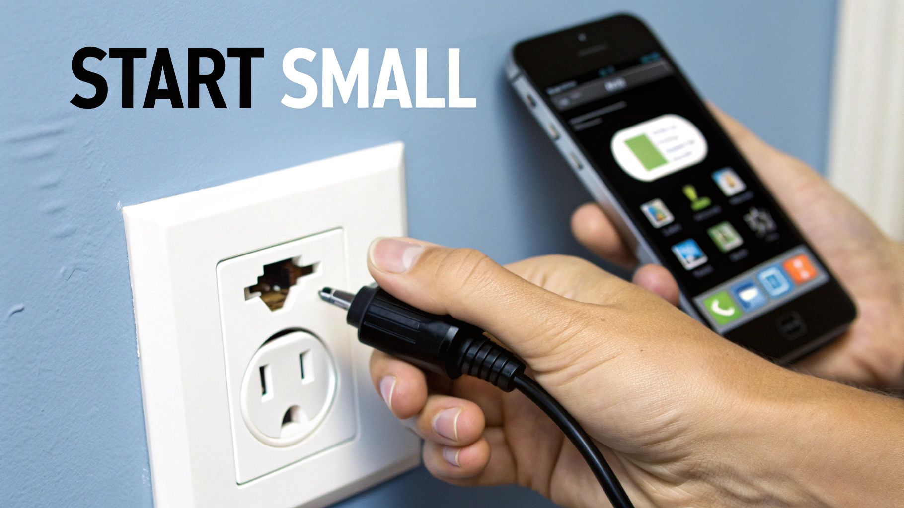 Person holding smartphone while plugging charging cable into wall outlet demonstrating smart home technology