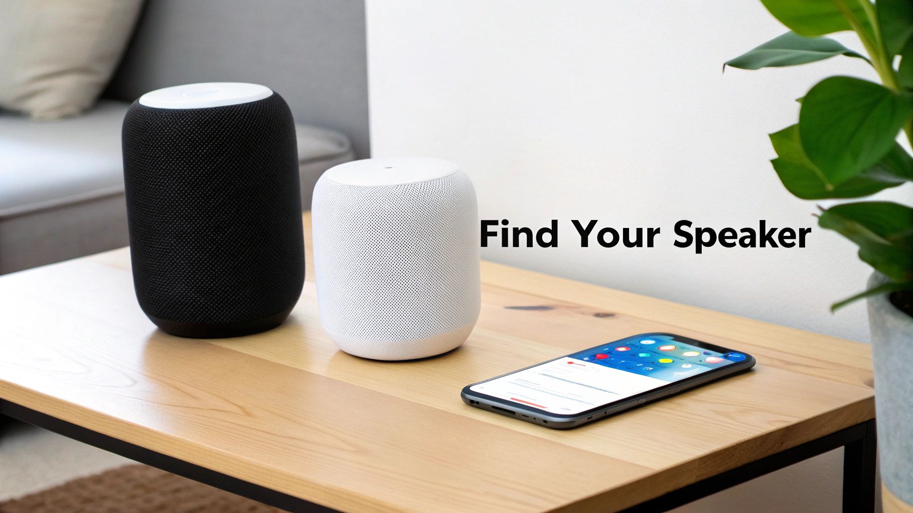 Two smart speakers, black and white, and a smartphone on a wooden table.