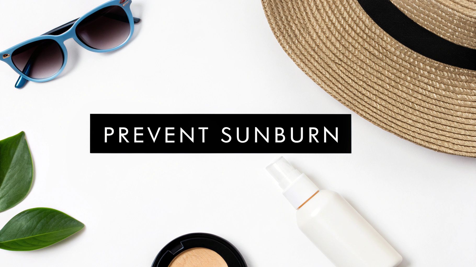 A flat lay of sun protection essentials: sunglasses, straw hat, sunscreen, and leaves.