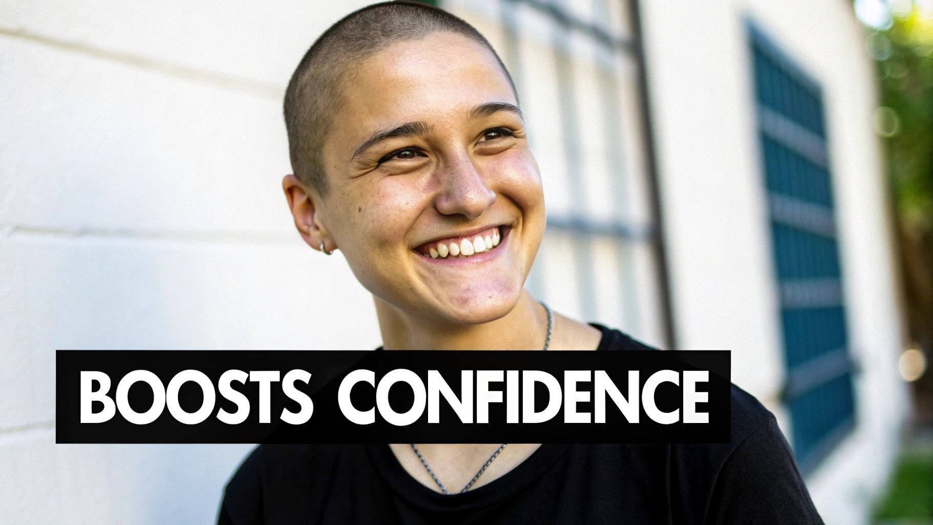 A man smiling confidently after his scalp micropigmentation treatment, showing a restored hairline and the appearance of a full head of hair.