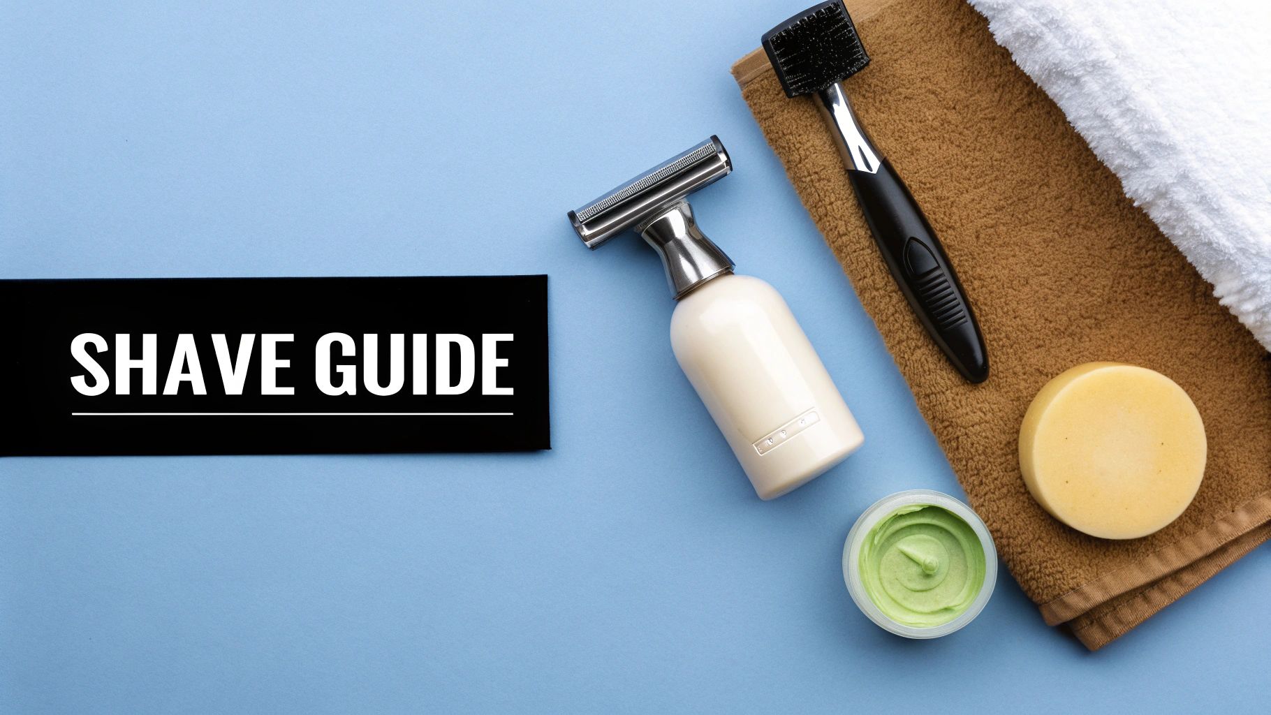 Man with a shaved head and beard looking thoughtfully to theside.