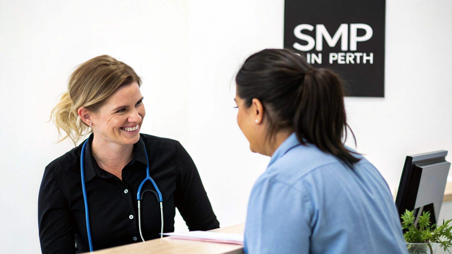 Healthcare professional consulting with patient at SMP in Perth clinic reception desk
