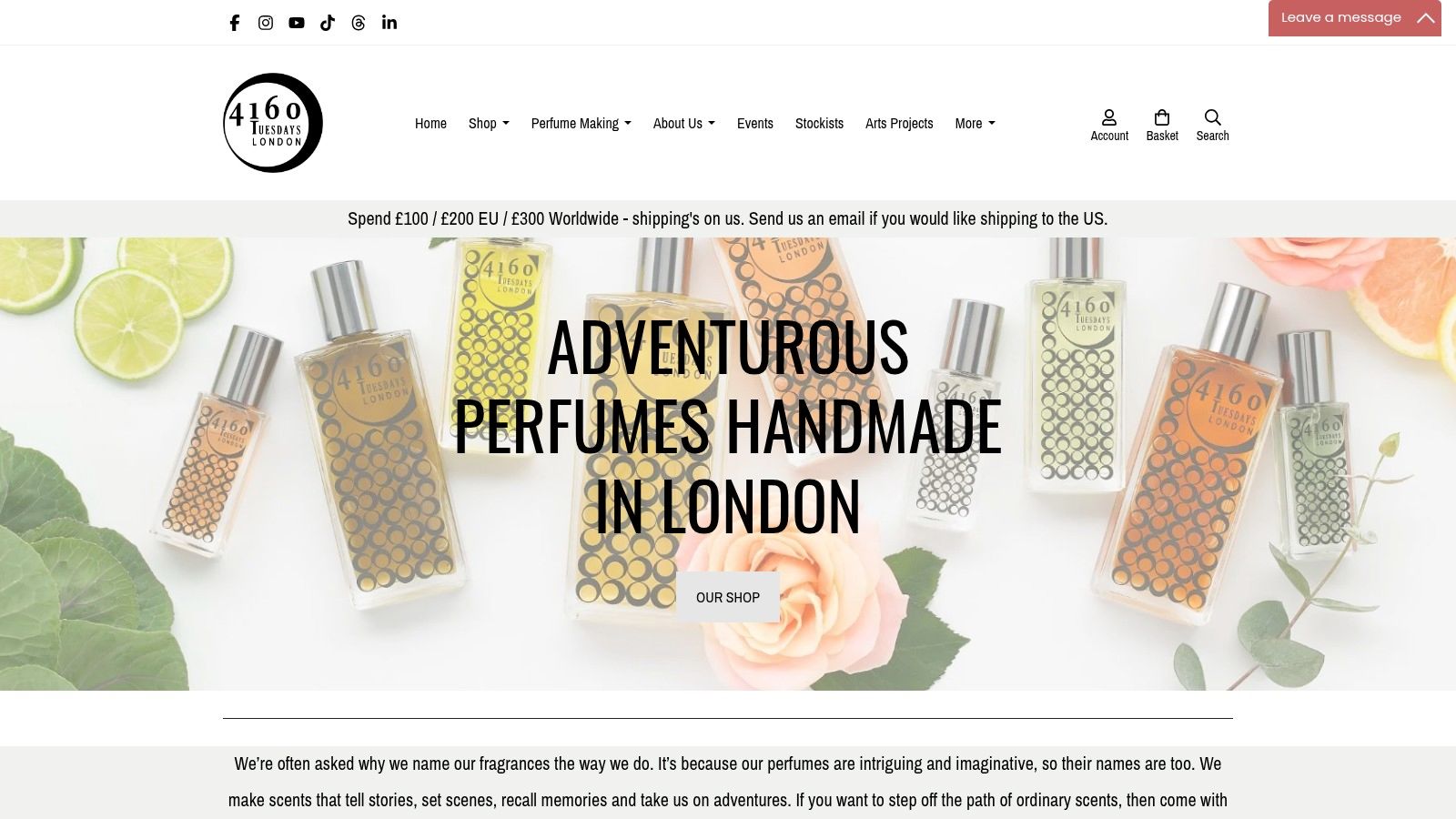 A collection of small perfume bottles and beakers on a wooden shelf at the 4160Tuesdays studio in London.