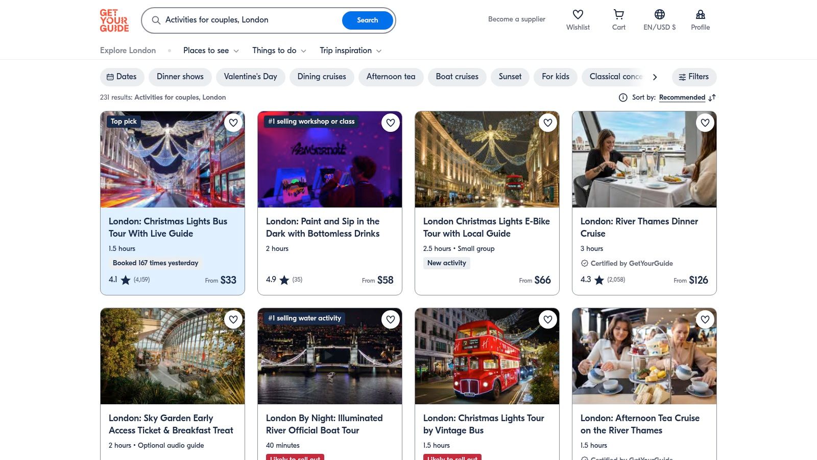 A couple enjoying a boat trip on the Thames, one of the many activities bookable on GetYourGuide