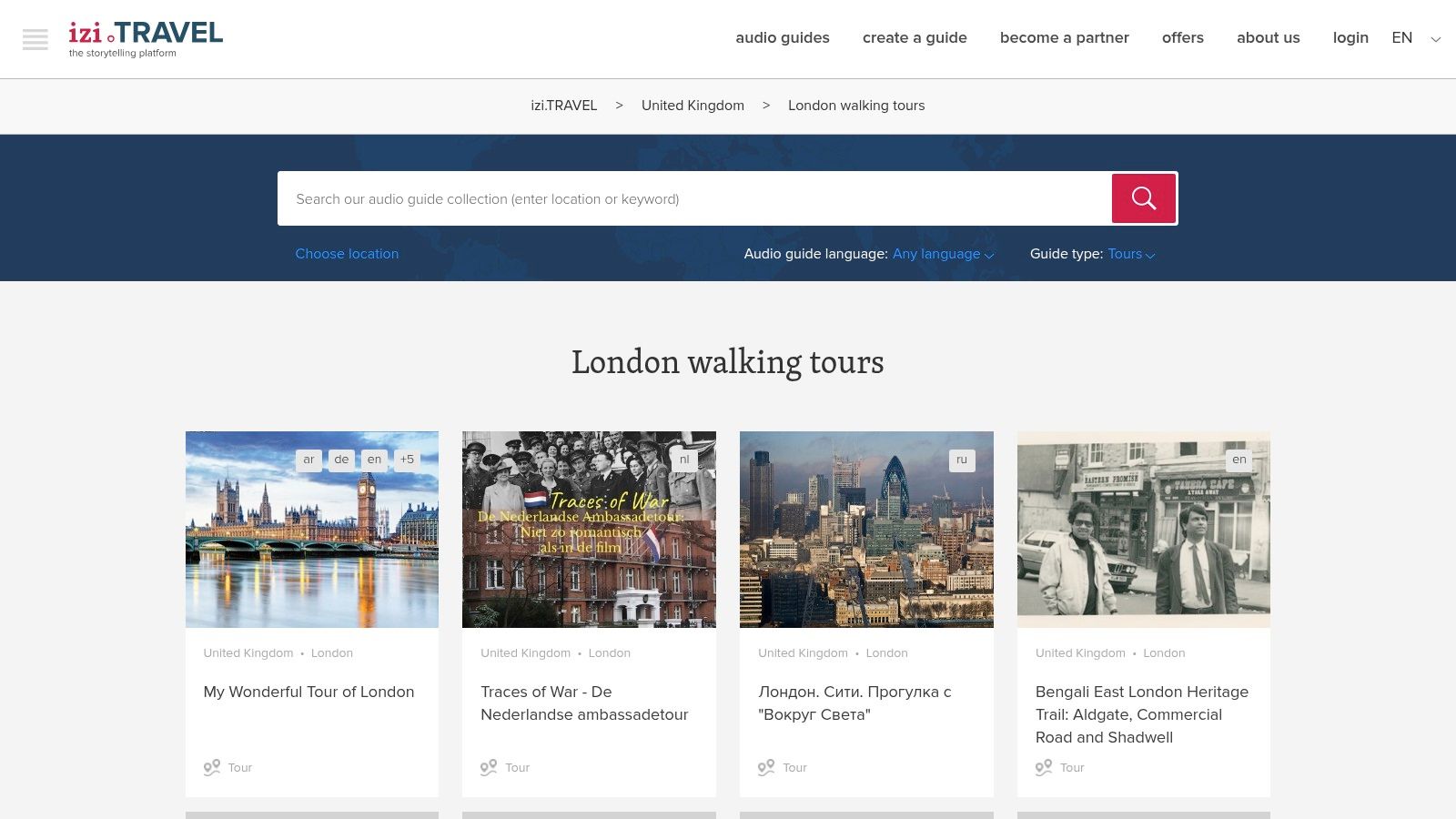 A person using the izi.TRAVEL app on their phone to follow a self-guided walking tour in London, with a map and points of interest visible on the screen.
