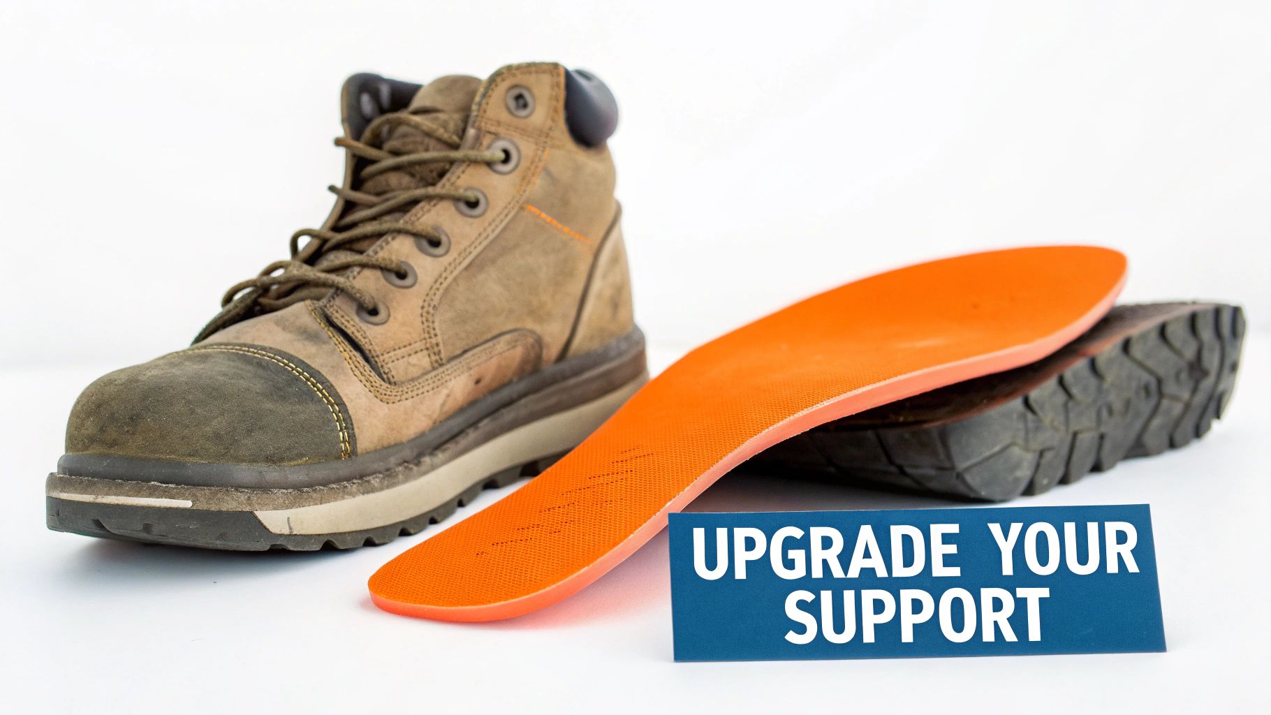 A brown work boot and a bright orange insole with a blue sign saying 'UPGRADE YOUR SUPPORT'.