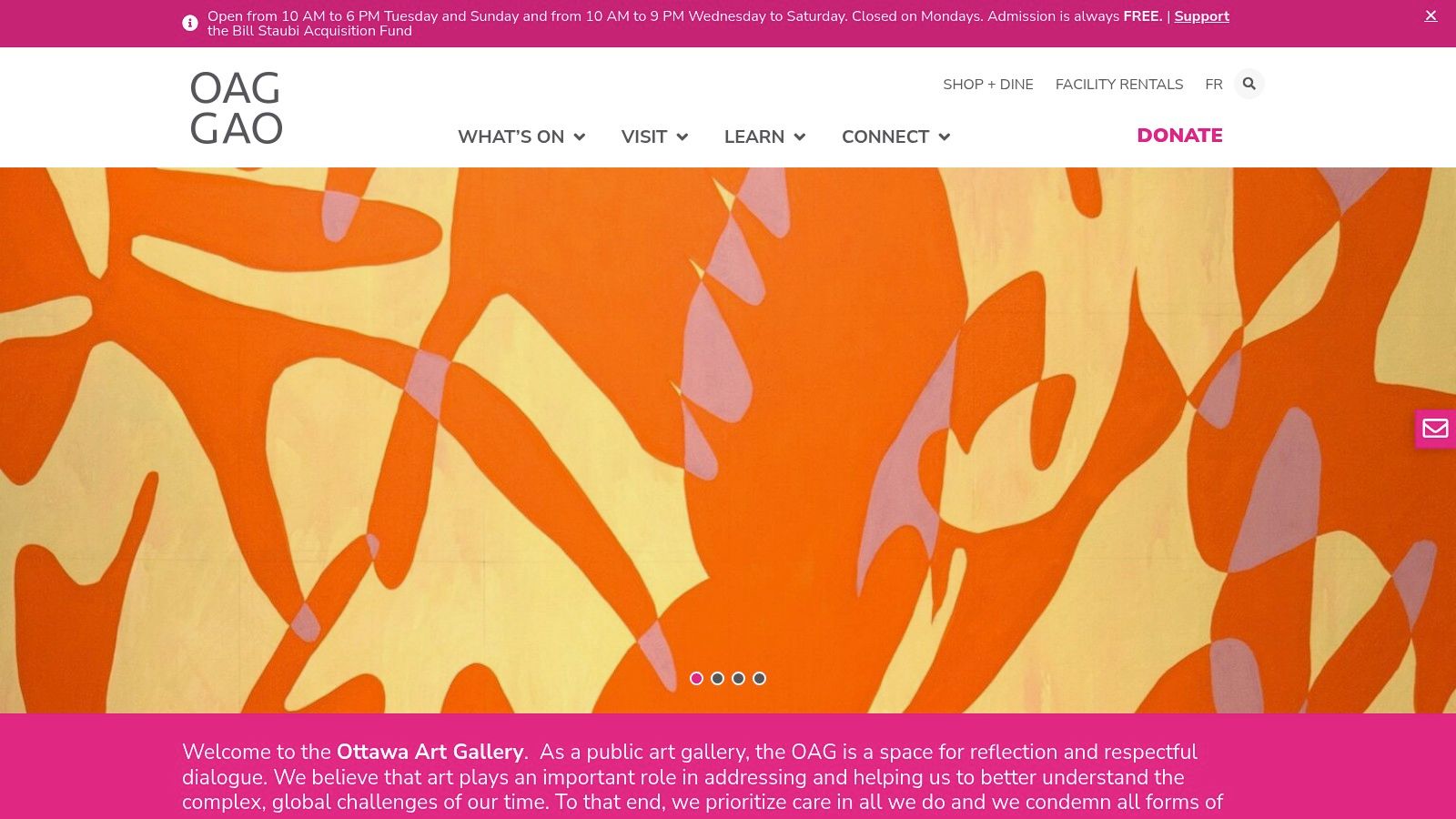 A bright, modern interior of the Ottawa Art Gallery with large windows, white walls, and various art pieces on display.