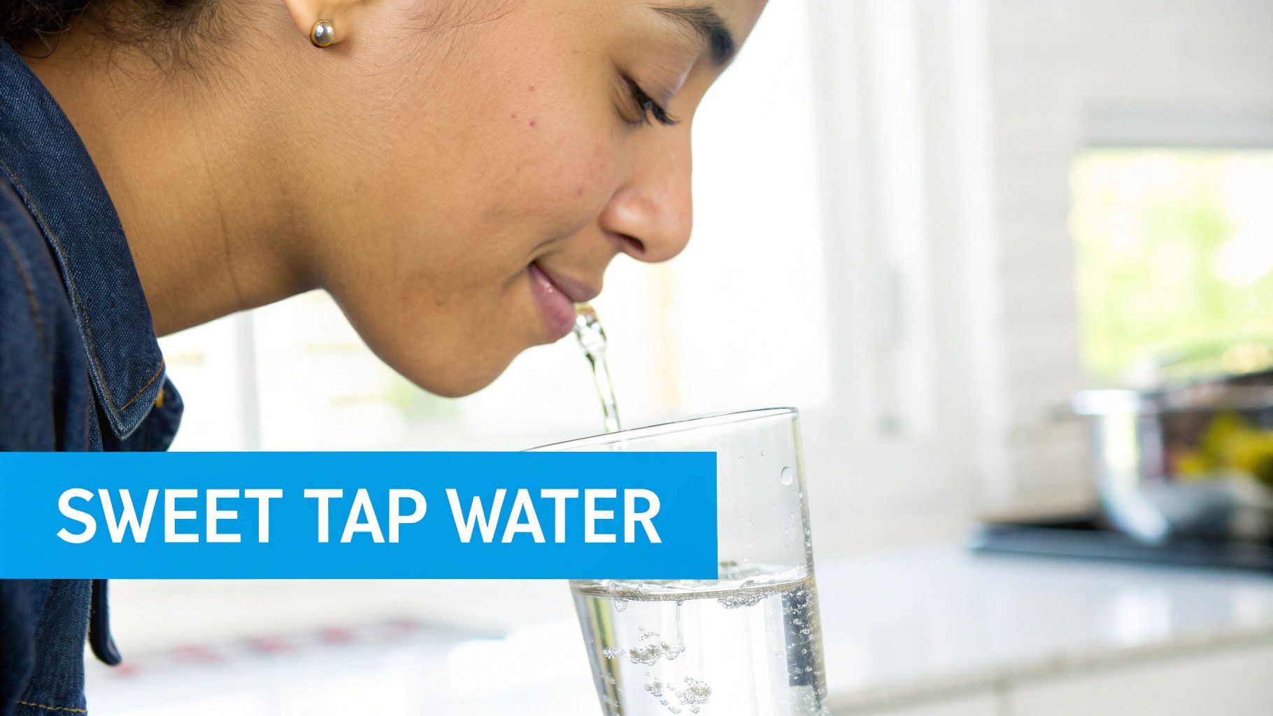 A woman drinking a glass of water, looking thoughtfully at its taste