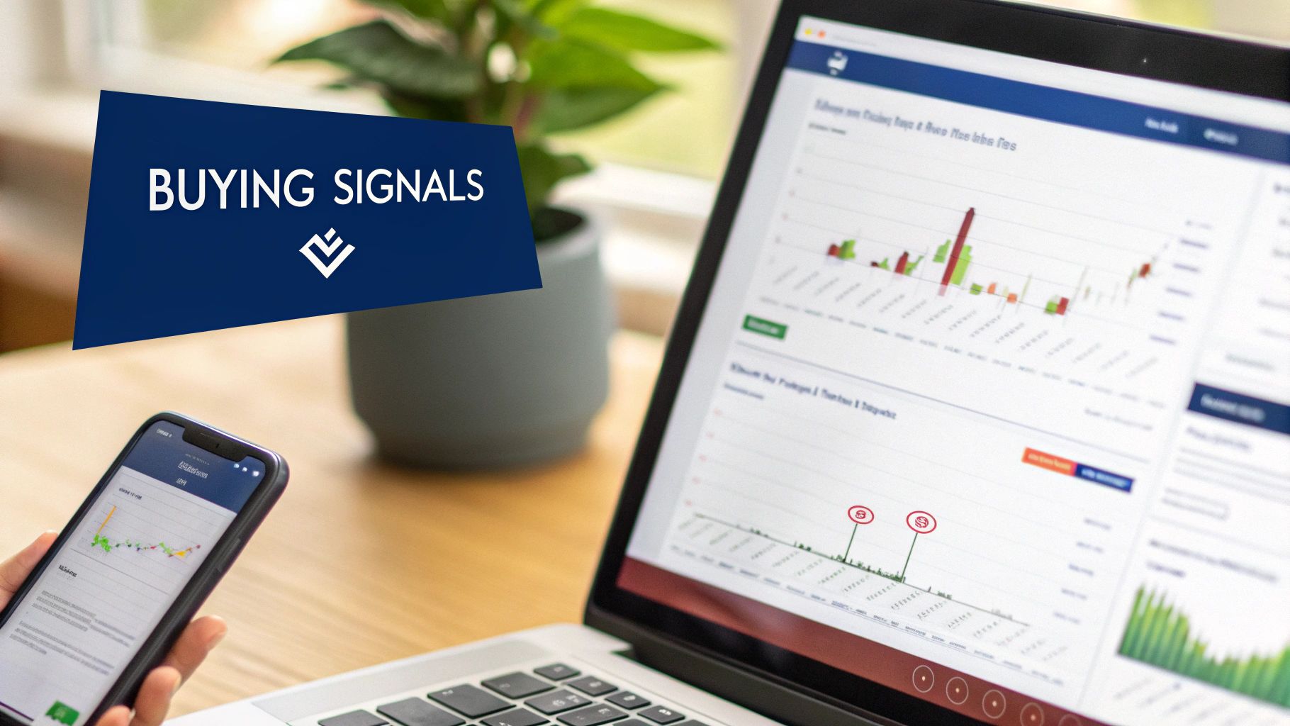 A person analyzes buying signals on a smartphone and laptop displaying financial charts and data.