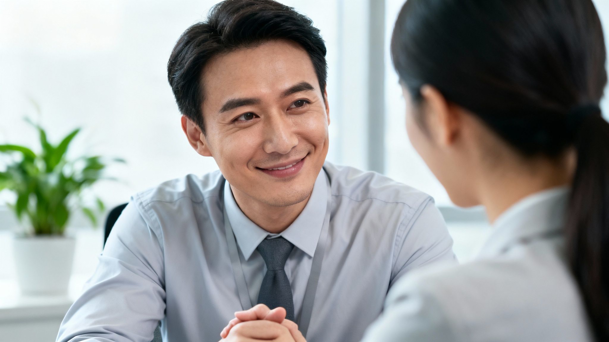 A manager listening with empathy to a team member in a positive work environment