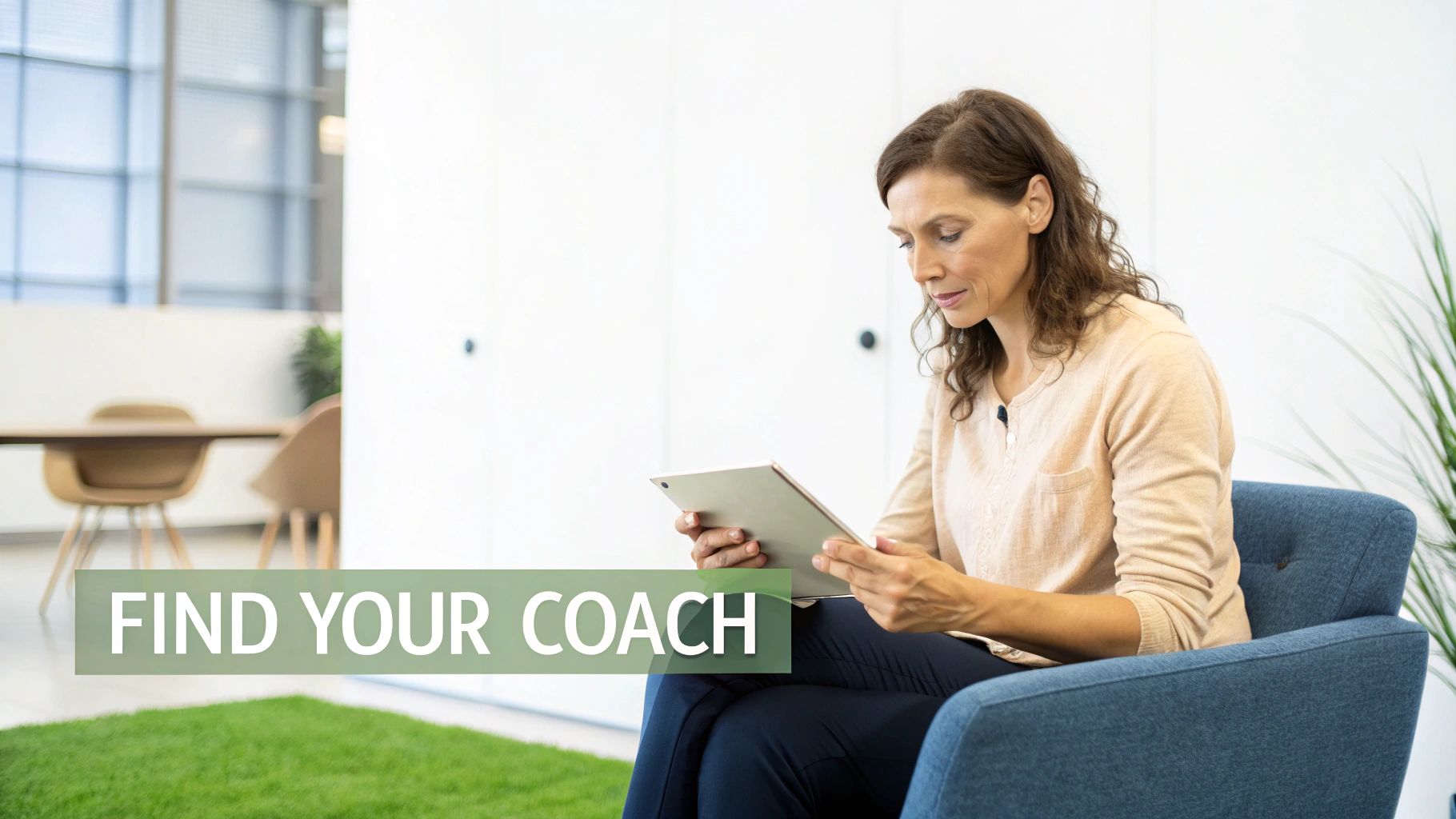 A woman reviews content on a tablet while sitting in a blue armchair in a modern office setting. A woman reviews content on a tablet while sitting in a blue armchair in a modern office setting.