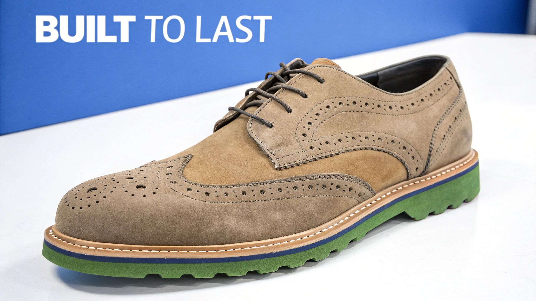 A person's hands holding a Goodyear welted shoe, showcasing its detailed stitching and construction.